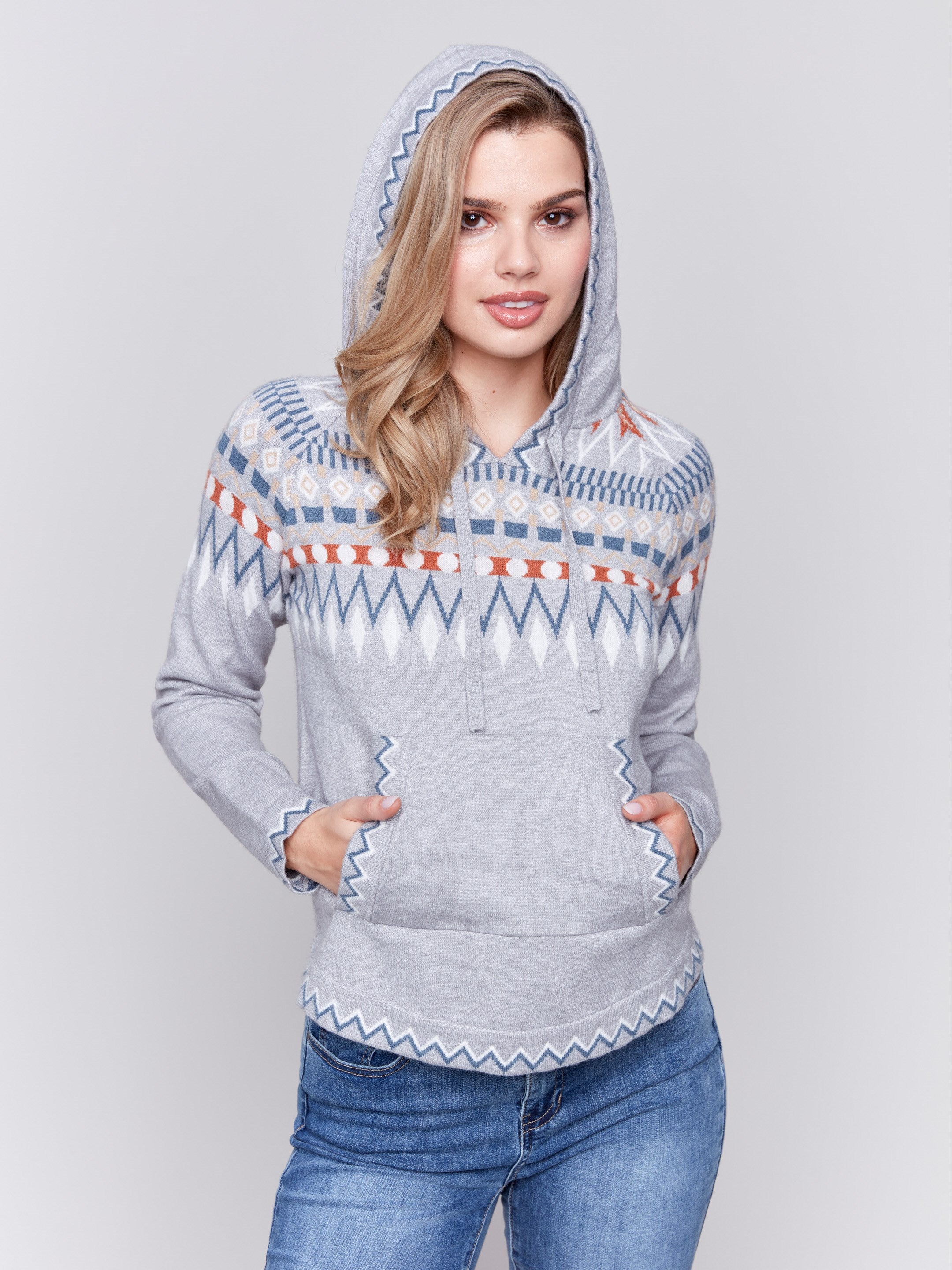 Grey plush knit sweater with a hood, featuring a geometric pattern and front kangaroo pouch by Charlie B.