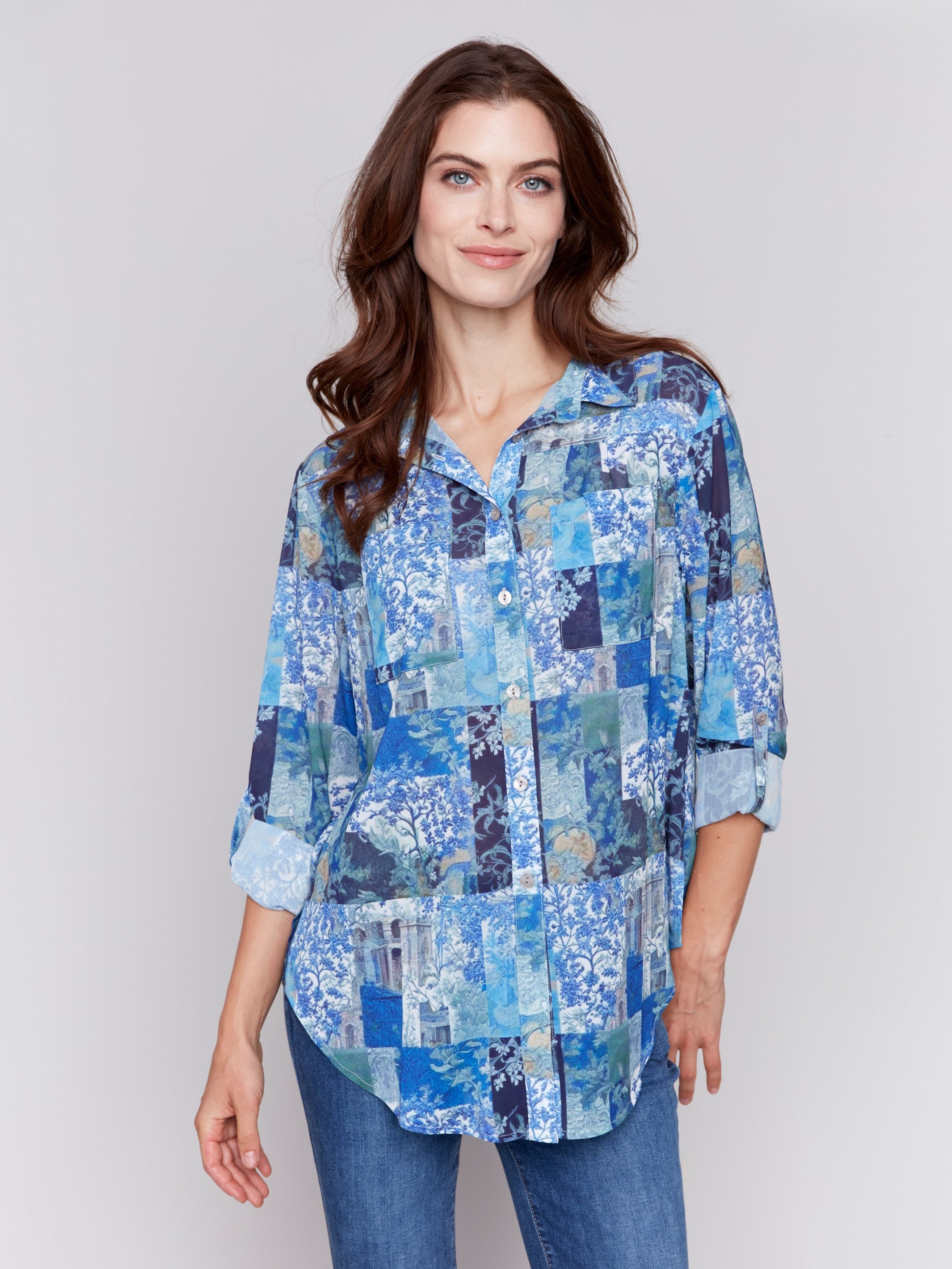 Blue printed blouse with button-front, featuring patch pockets and roll-up sleeves by Charlie B