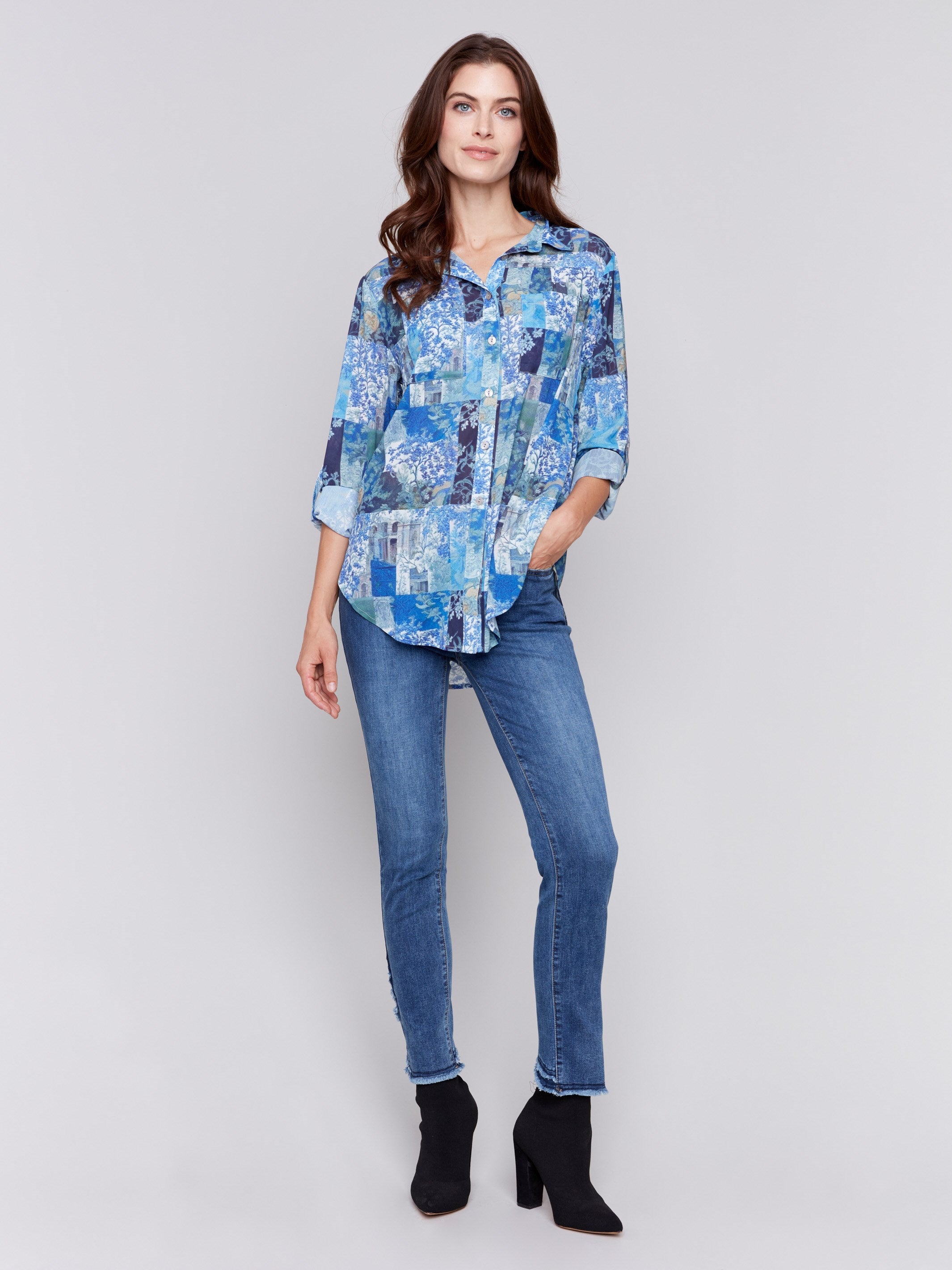 Blue printed blouse with button-front, featuring patch pockets and roll-up sleeves by Charlie B