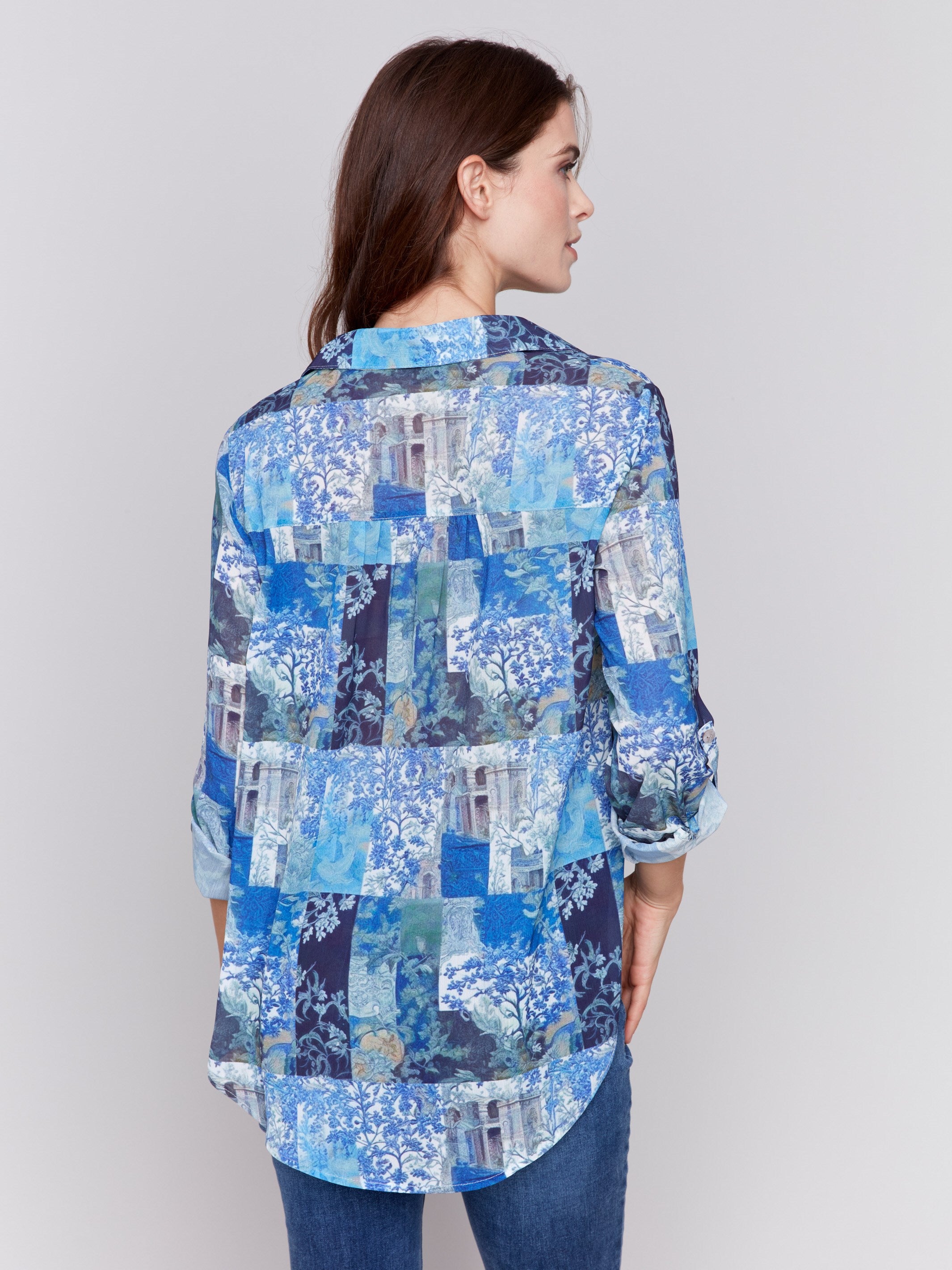 Blue printed blouse with button-front, featuring patch pockets and roll-up sleeves by Charlie B