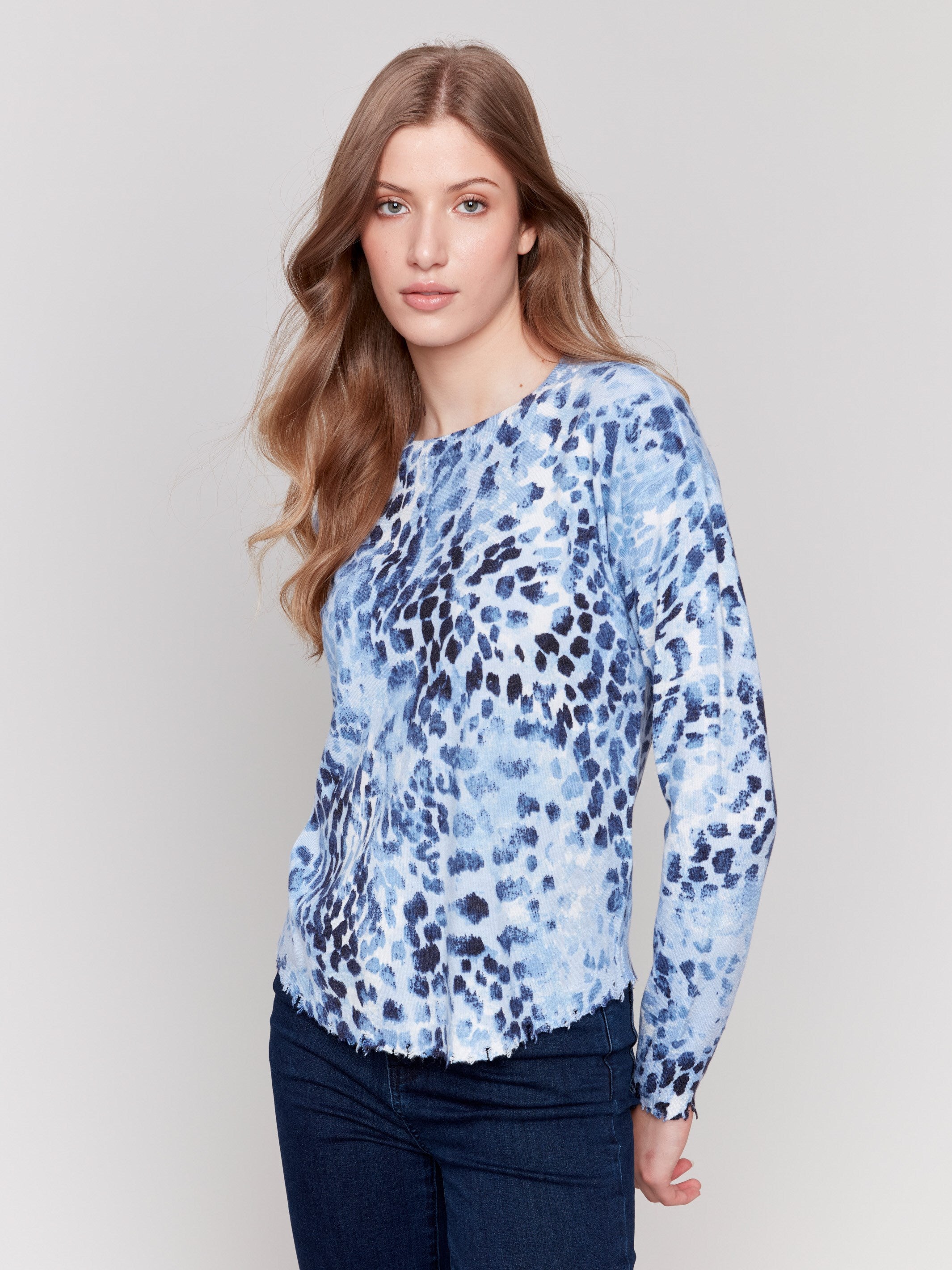 Long-sleeve indigo sweater with a crew neck and frayed edge by Charlie B.