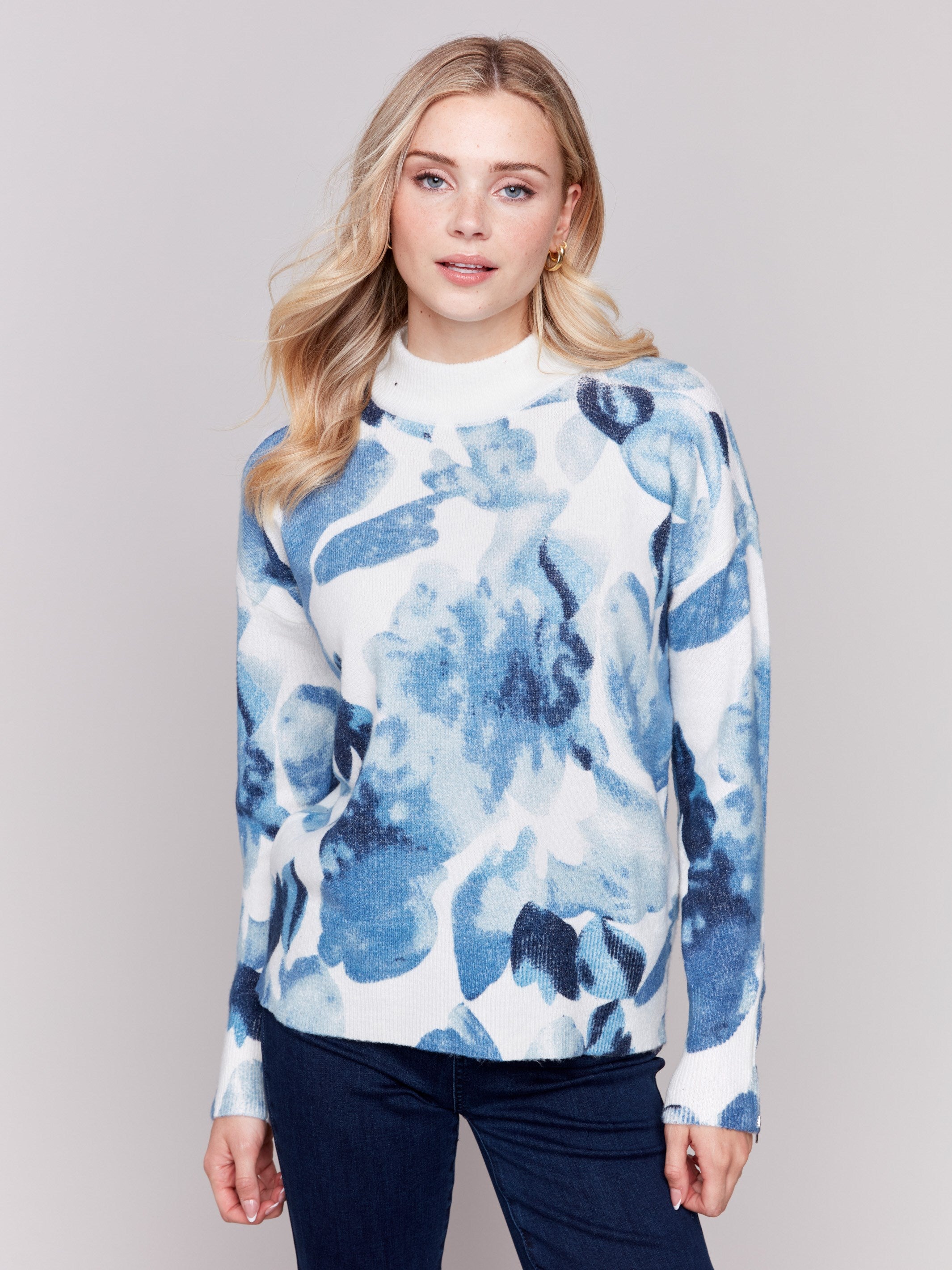 Navy storm blue sweater with abstract print and mock neck, featuring zippers on sleeves by Charlie B.