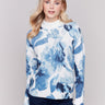 Navy storm blue sweater with abstract print and mock neck, featuring zippers on sleeves by Charlie B.