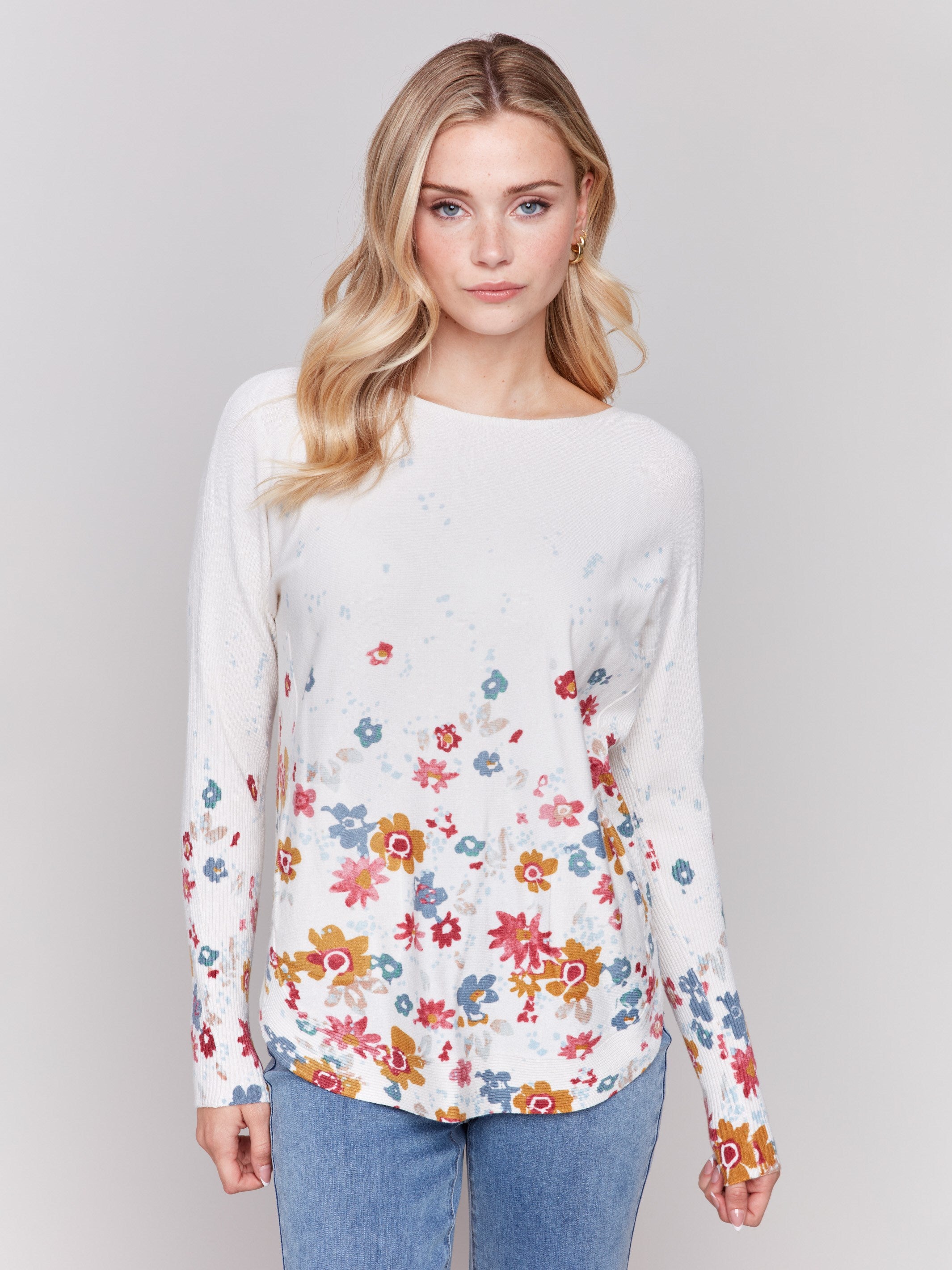 White sweater with colorful floral prints, long sleeves and crew neckline by Charlie B.