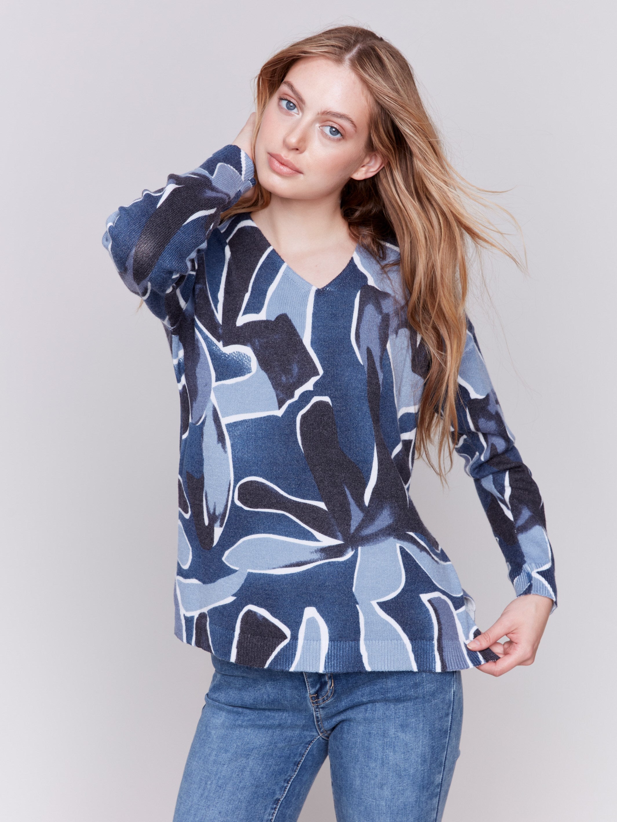 Denim blue V-neck sweater with an abstract print and drop shoulders by Charlie B.