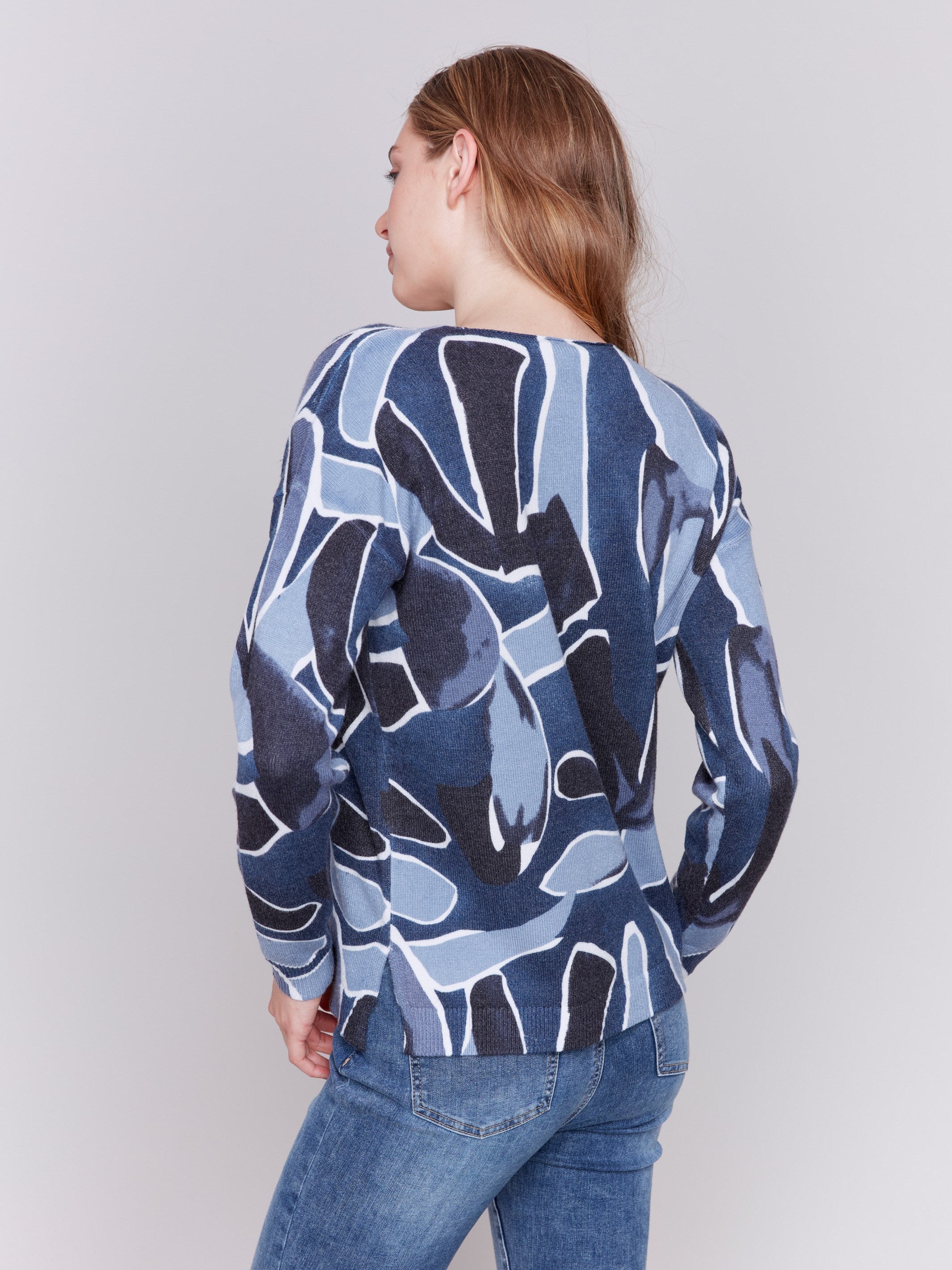 Denim blue V-neck sweater with an abstract print and drop shoulders by Charlie B.