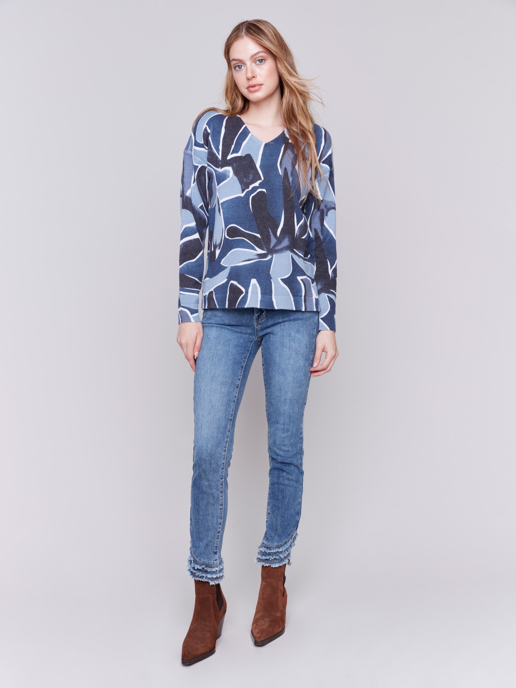 Denim blue V-neck sweater with an abstract print and drop shoulders by Charlie B.