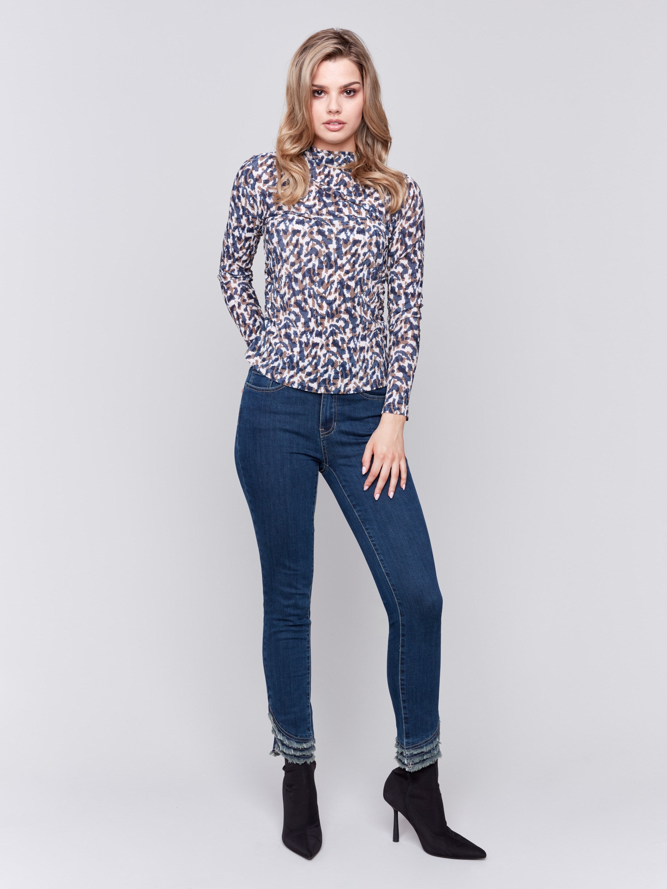 Long sleeve mock neck top with a safari print by Charlie B.