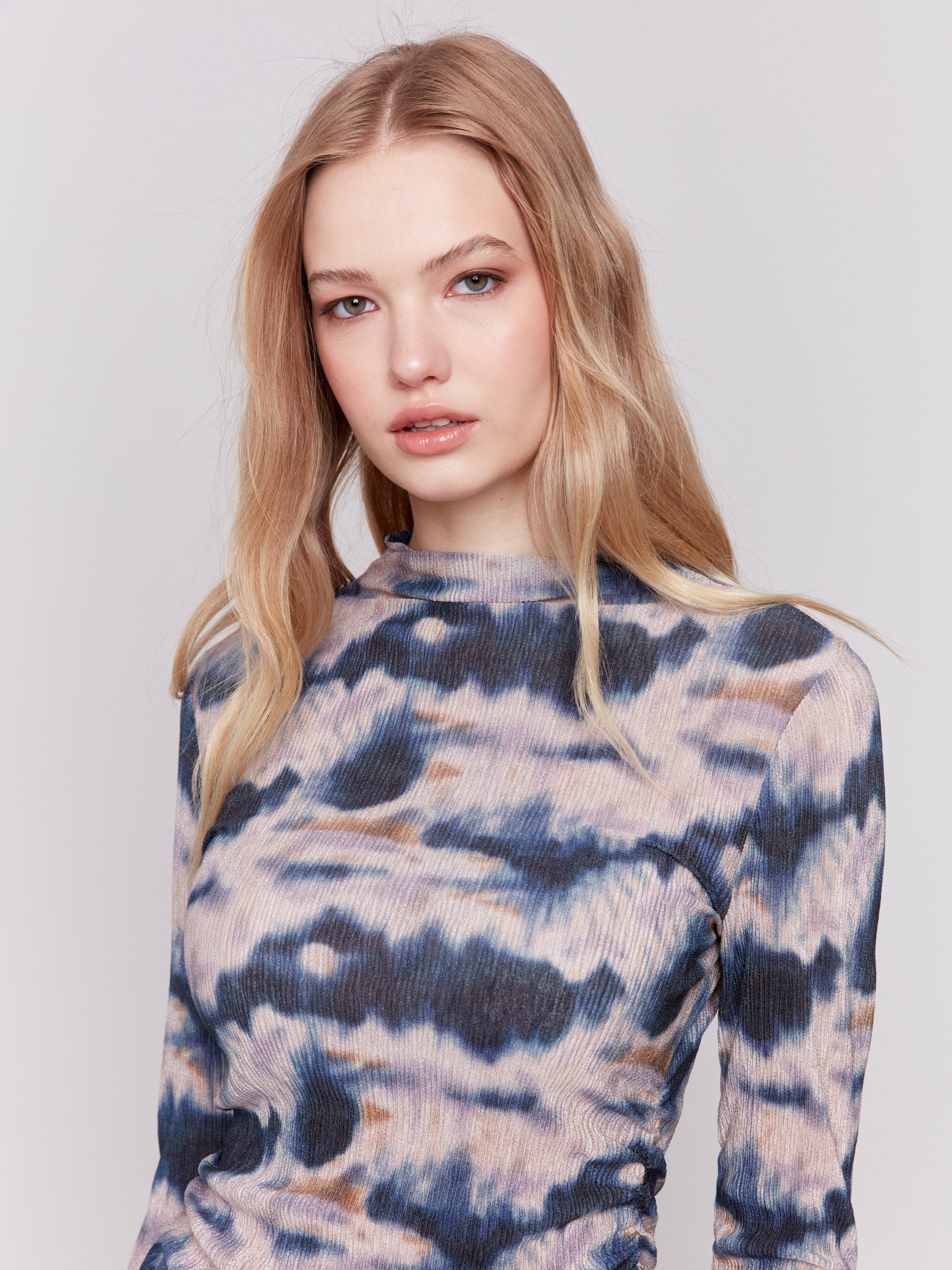 Long sleeve mock neck top with a tie-dye pattern by Charlie B.