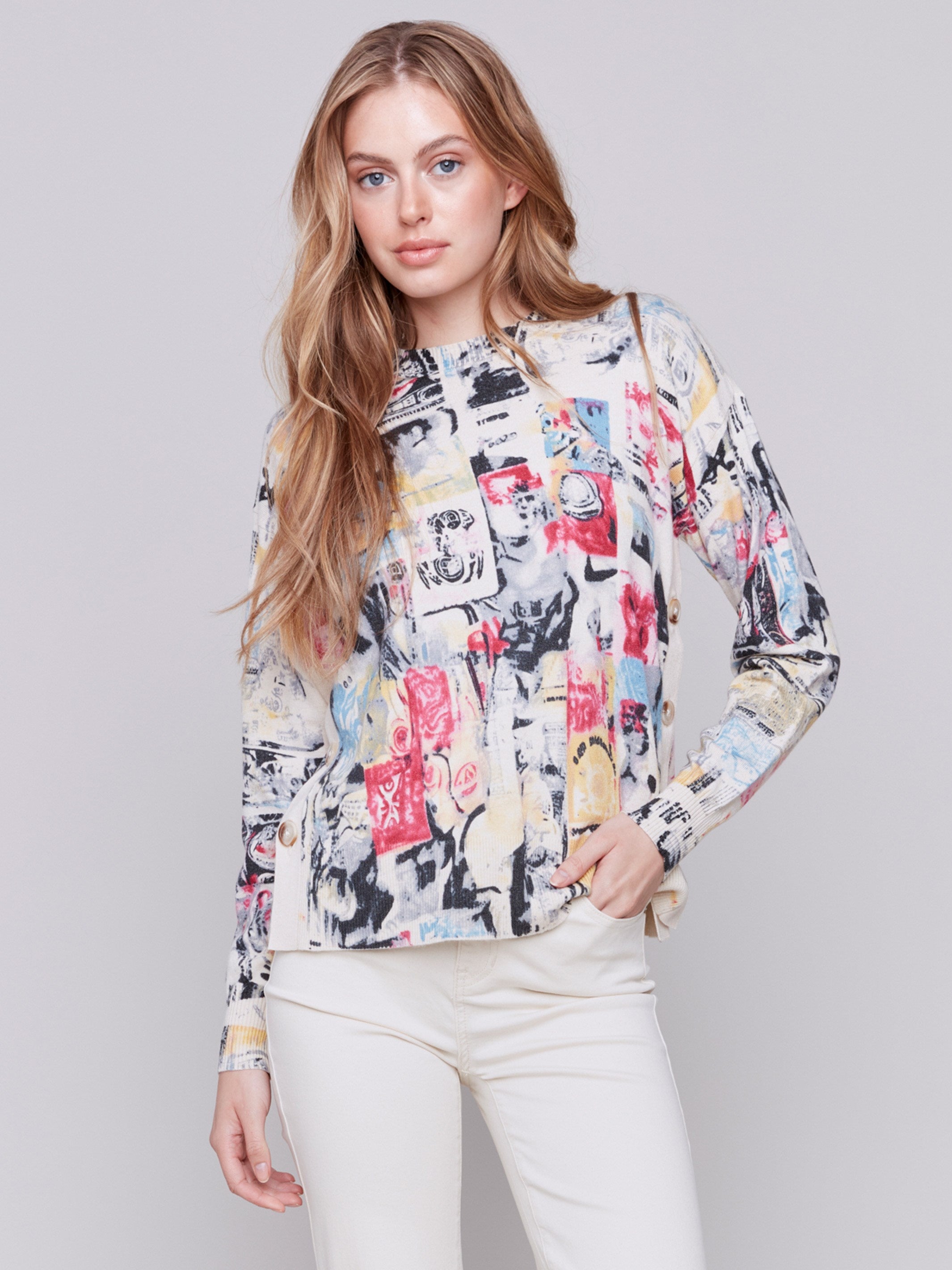 Multi-colored cartoon printed sweater with long sleeves, crew neck, and side button details by Charlie B.