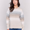 Striped sweater with long sleeves and side buttons, featuring a cozy and chic design by Charlie B.