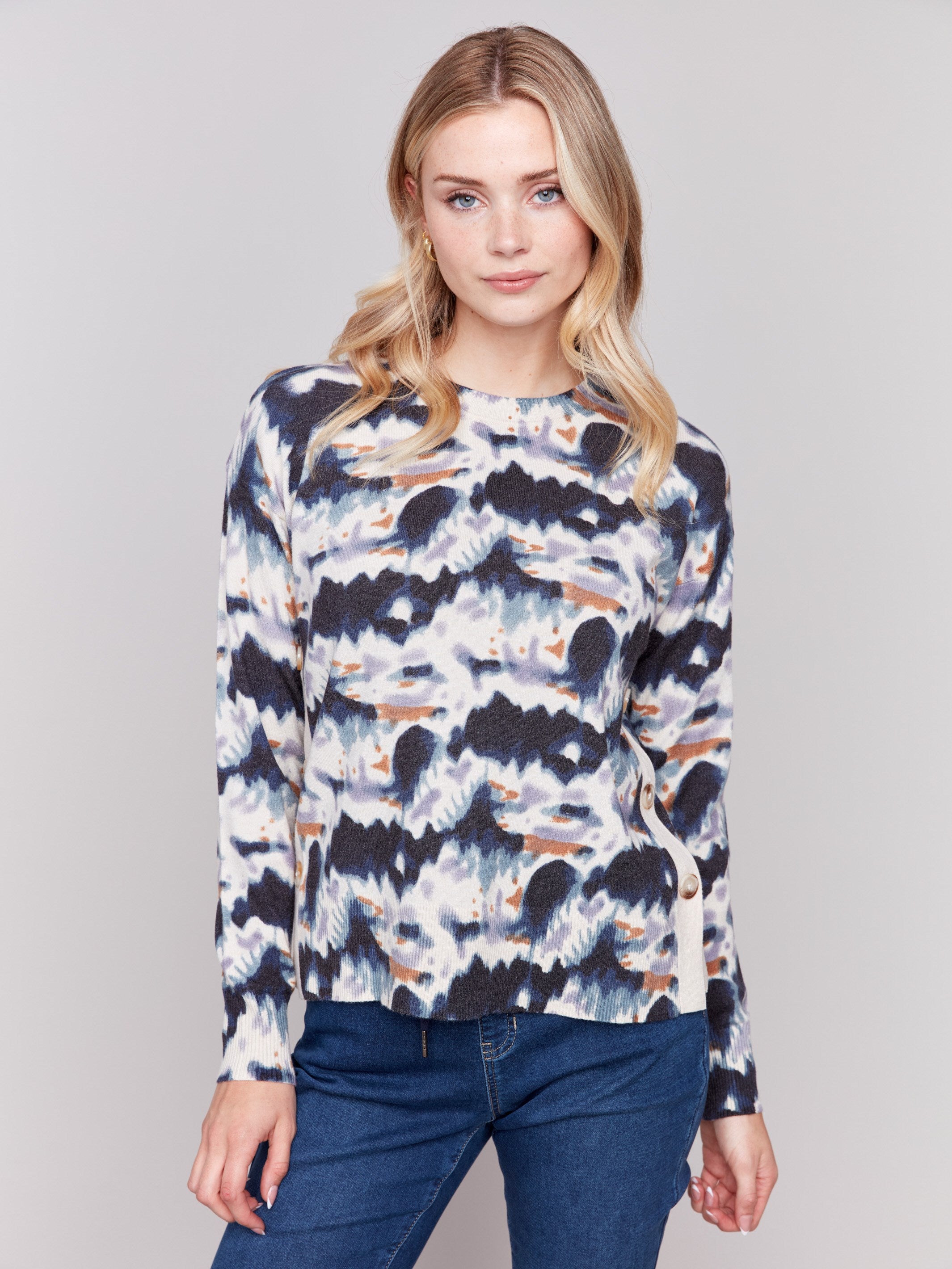 Tie dye printed sweater with long sleeves, crew neck, and side button details by Charlie B.