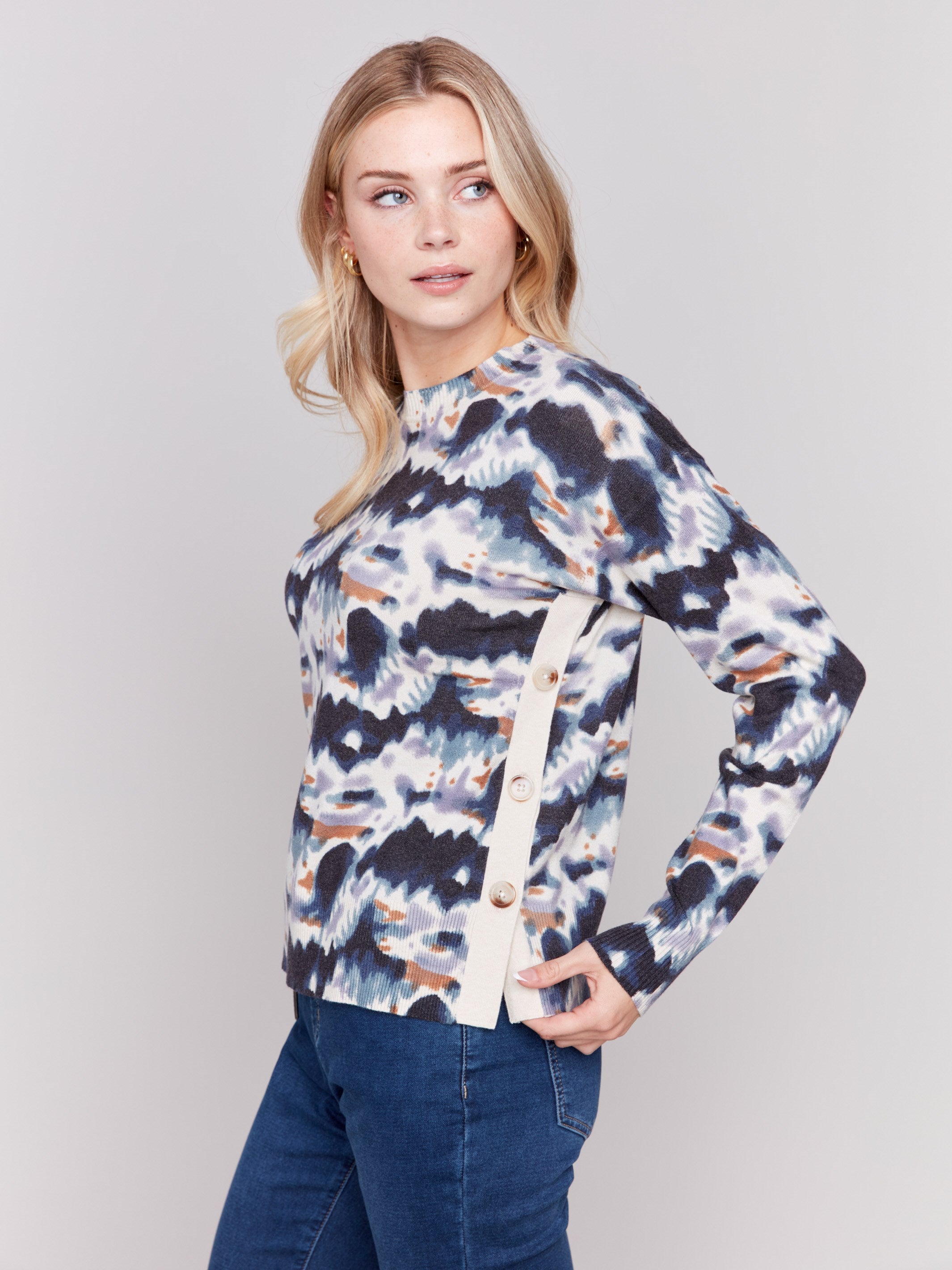 Tie dye printed sweater with long sleeves, crew neck, and side button details by Charlie B.