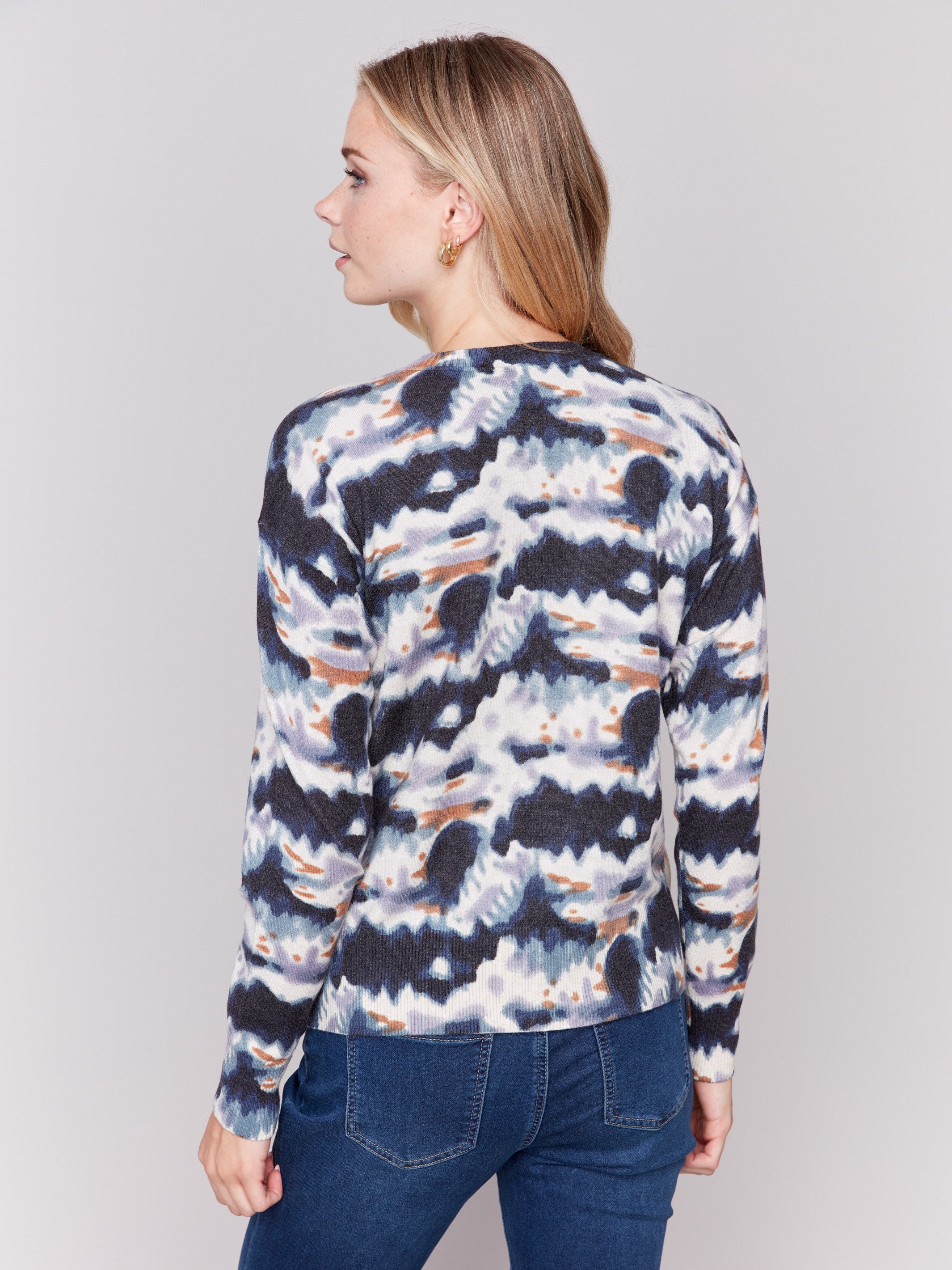 Tie dye printed sweater with long sleeves, crew neck, and side button details by Charlie B.