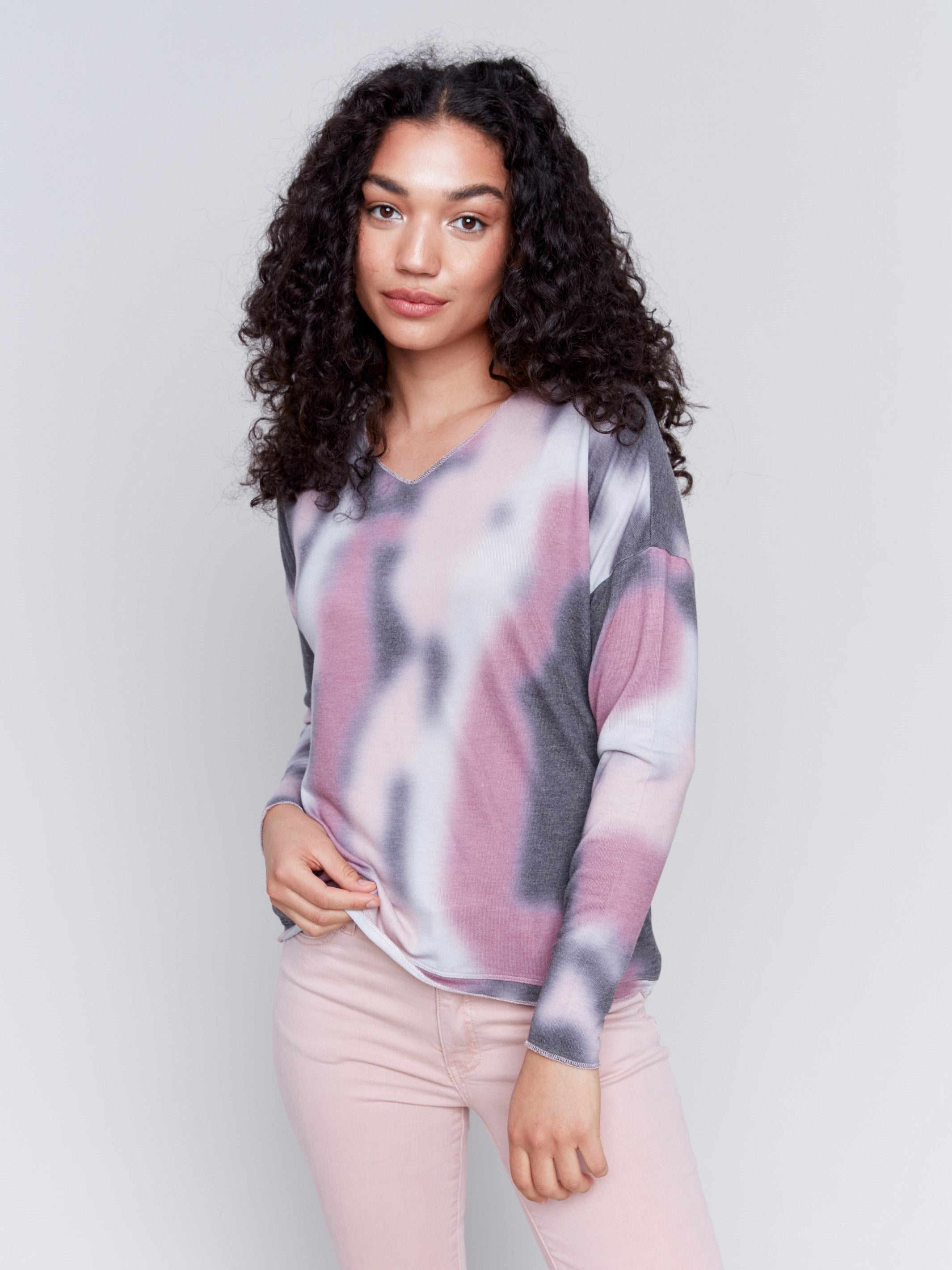 Long-sleeve V-neck knit top with a unique tie-dye print by Charlie B.