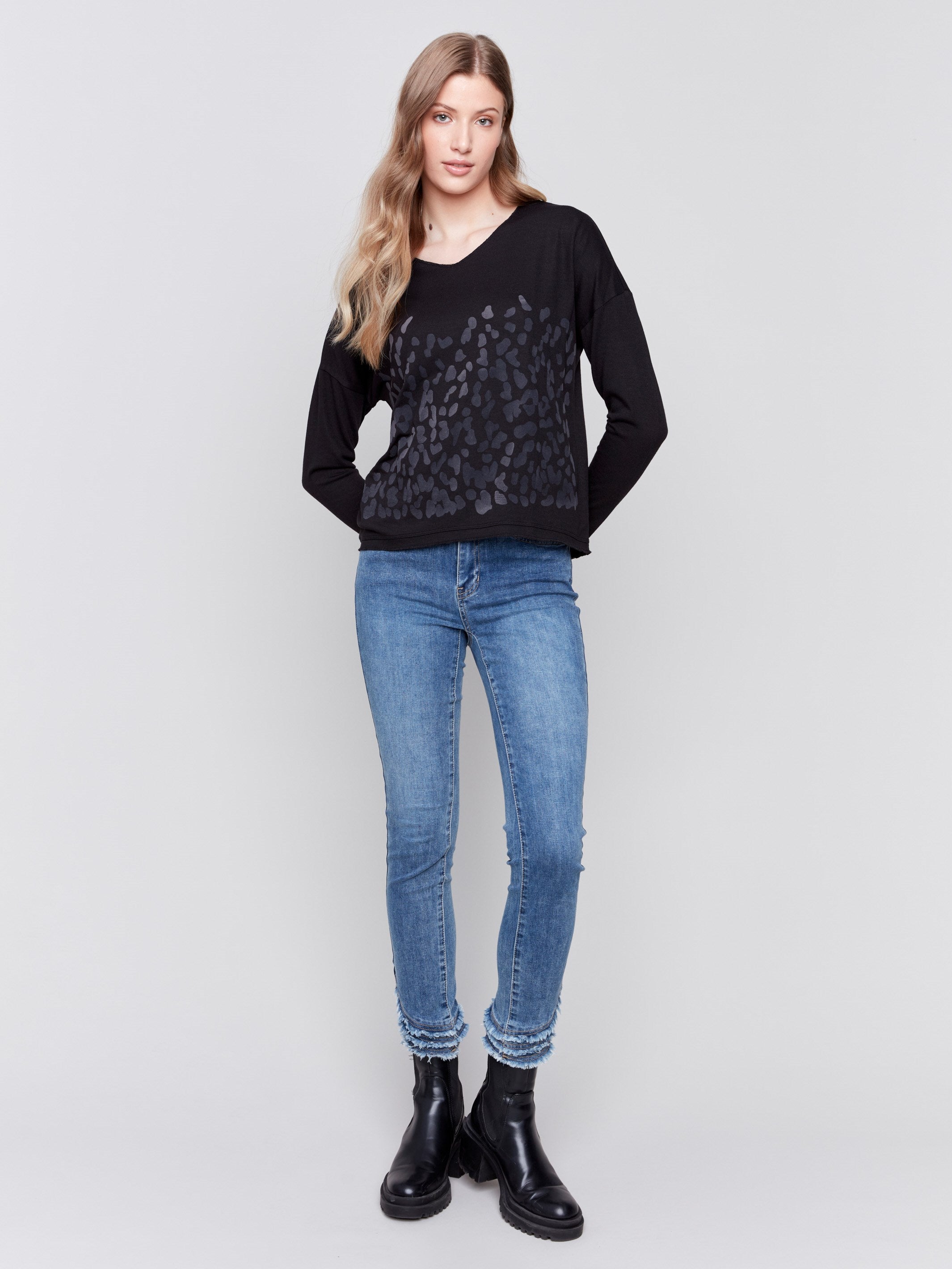 Long-sleeve V-neck knit top with a unique animal print by Charlie B.