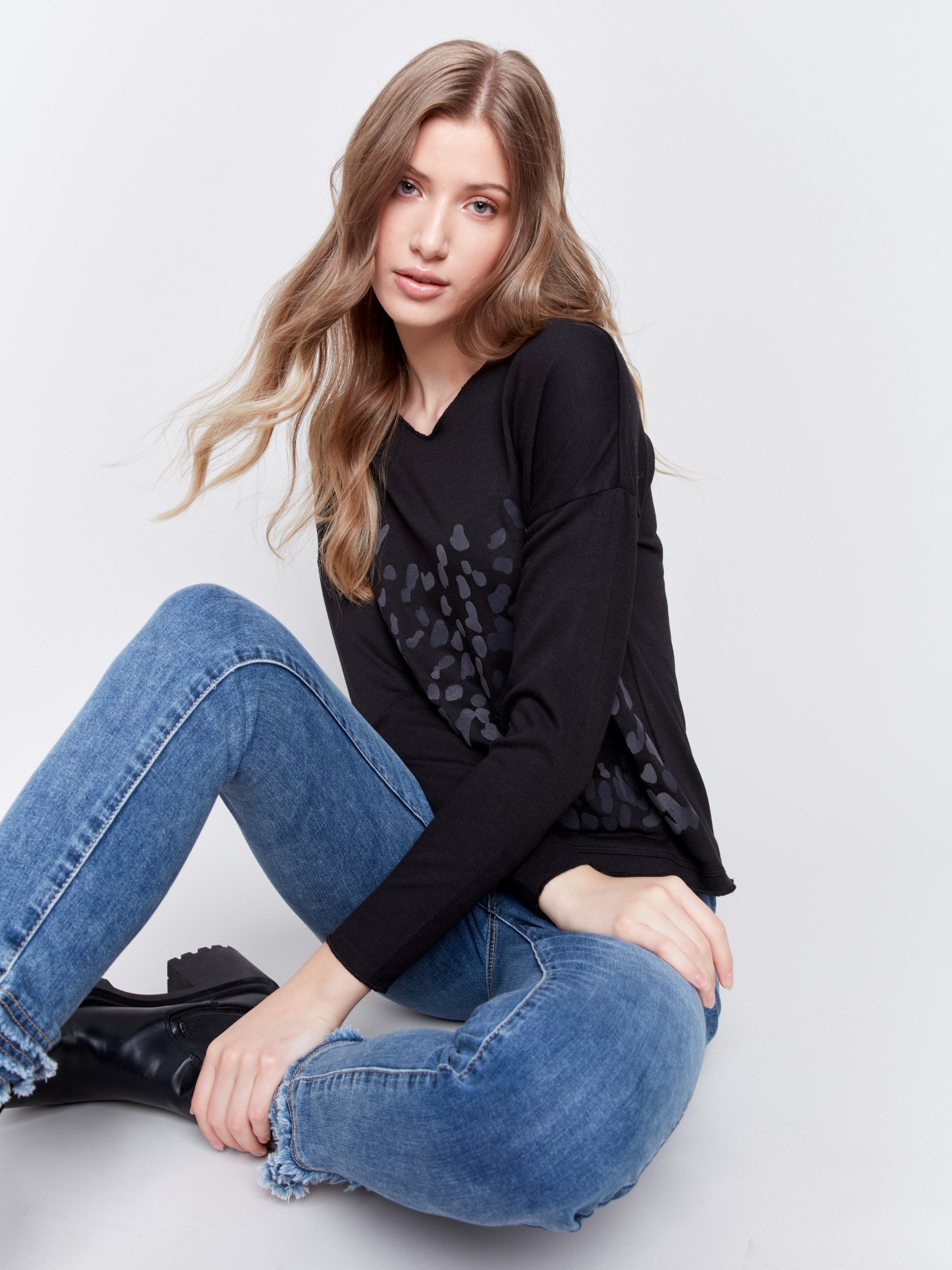 Long-sleeve V-neck knit top with a unique animal print by Charlie B.