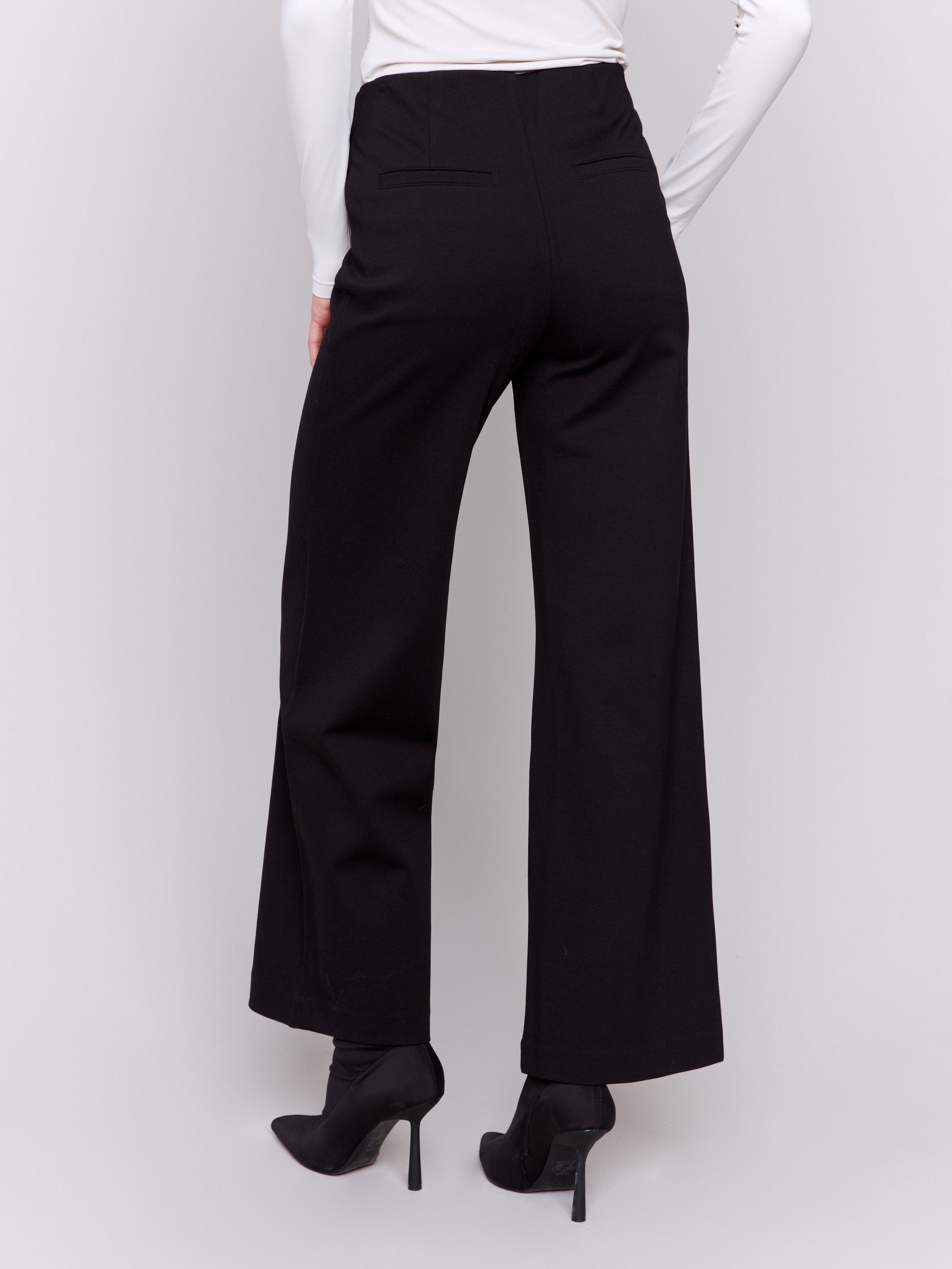 Black flared pants with pull-on style and elastic waistband by Charlie B.