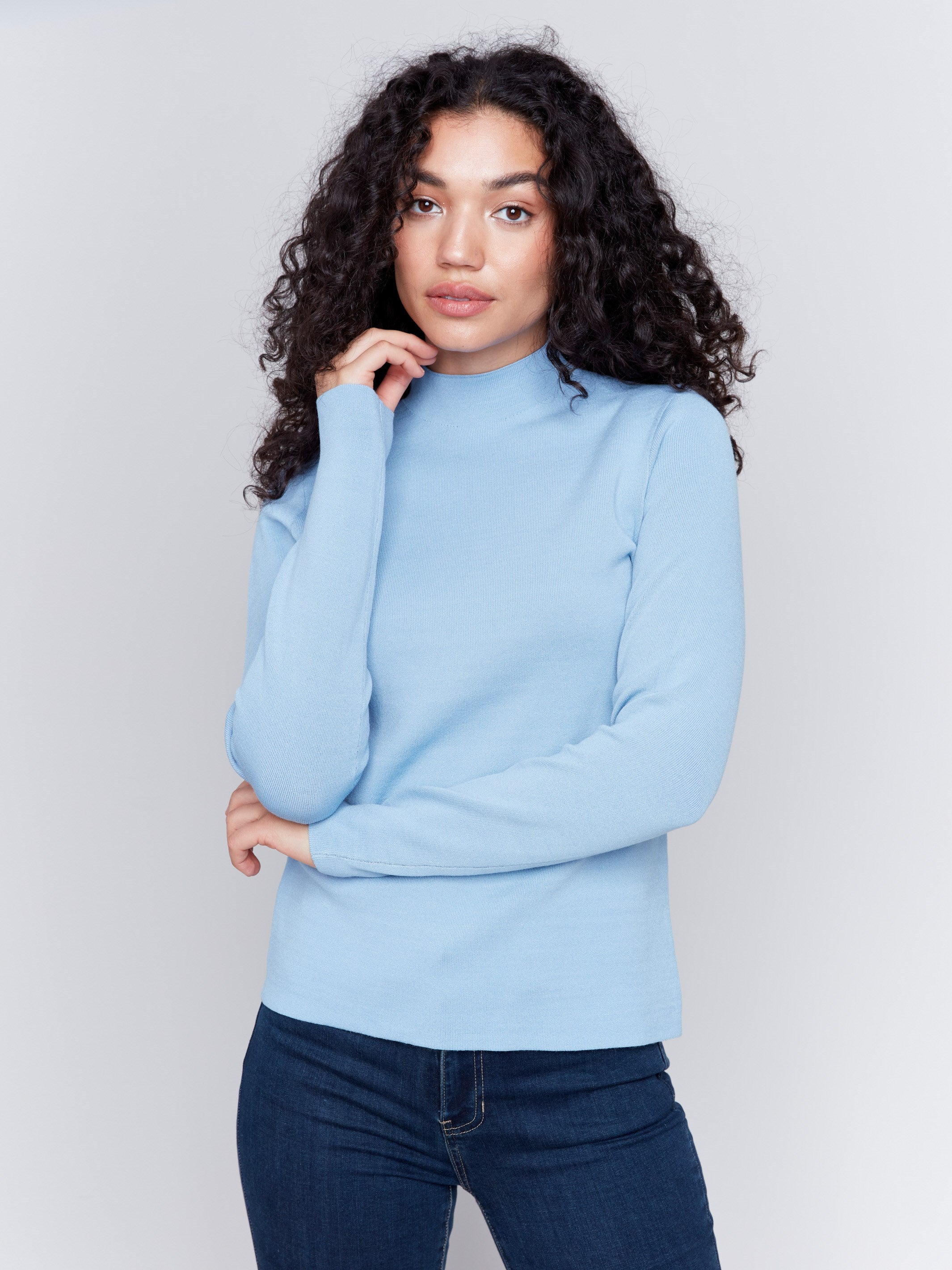 Long-sleeve reversible mock neck sweater in light and dark blue by Charlie B.