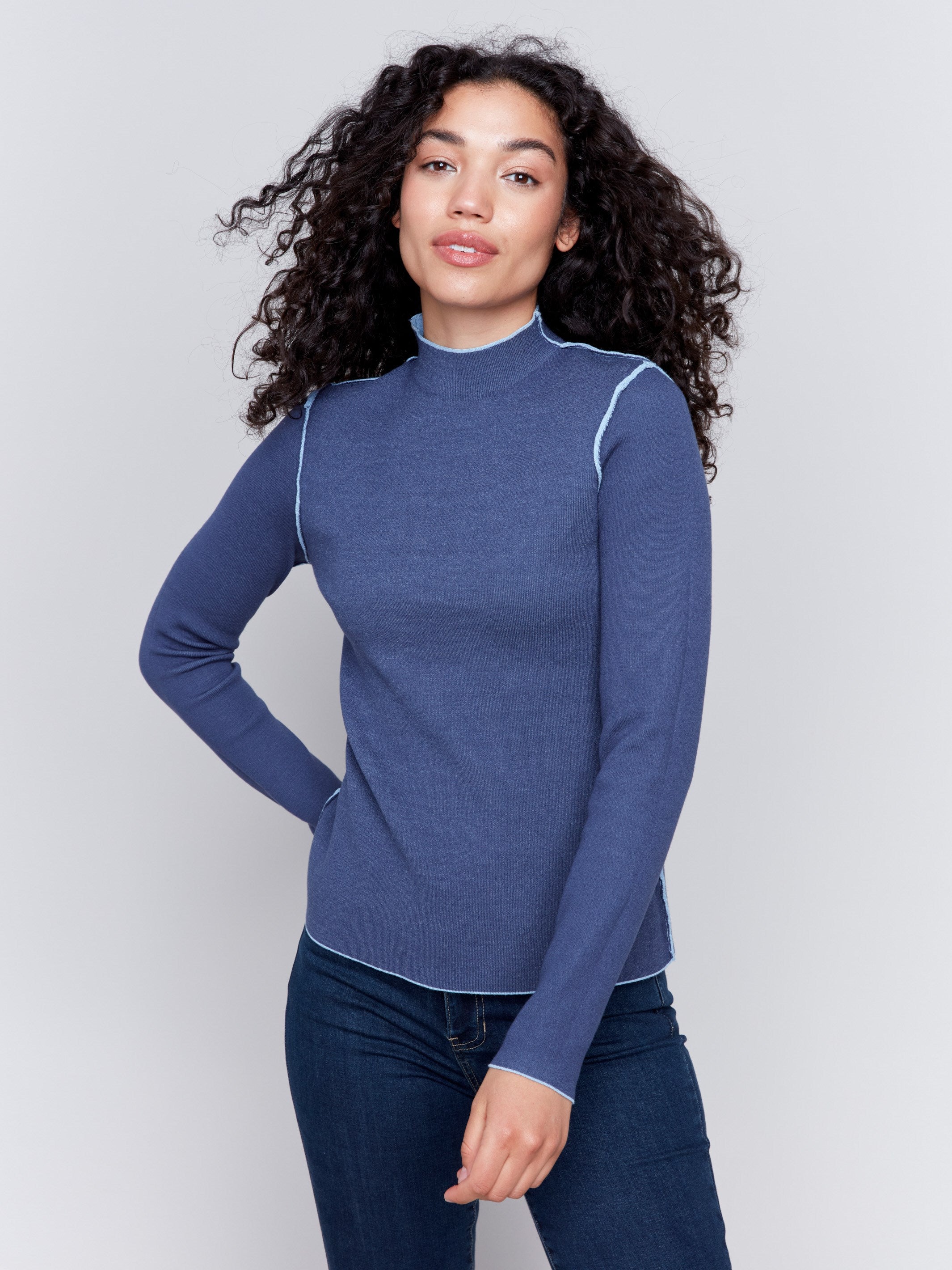 Long-sleeve reversible mock neck sweater in light and dark blue by Charlie B.