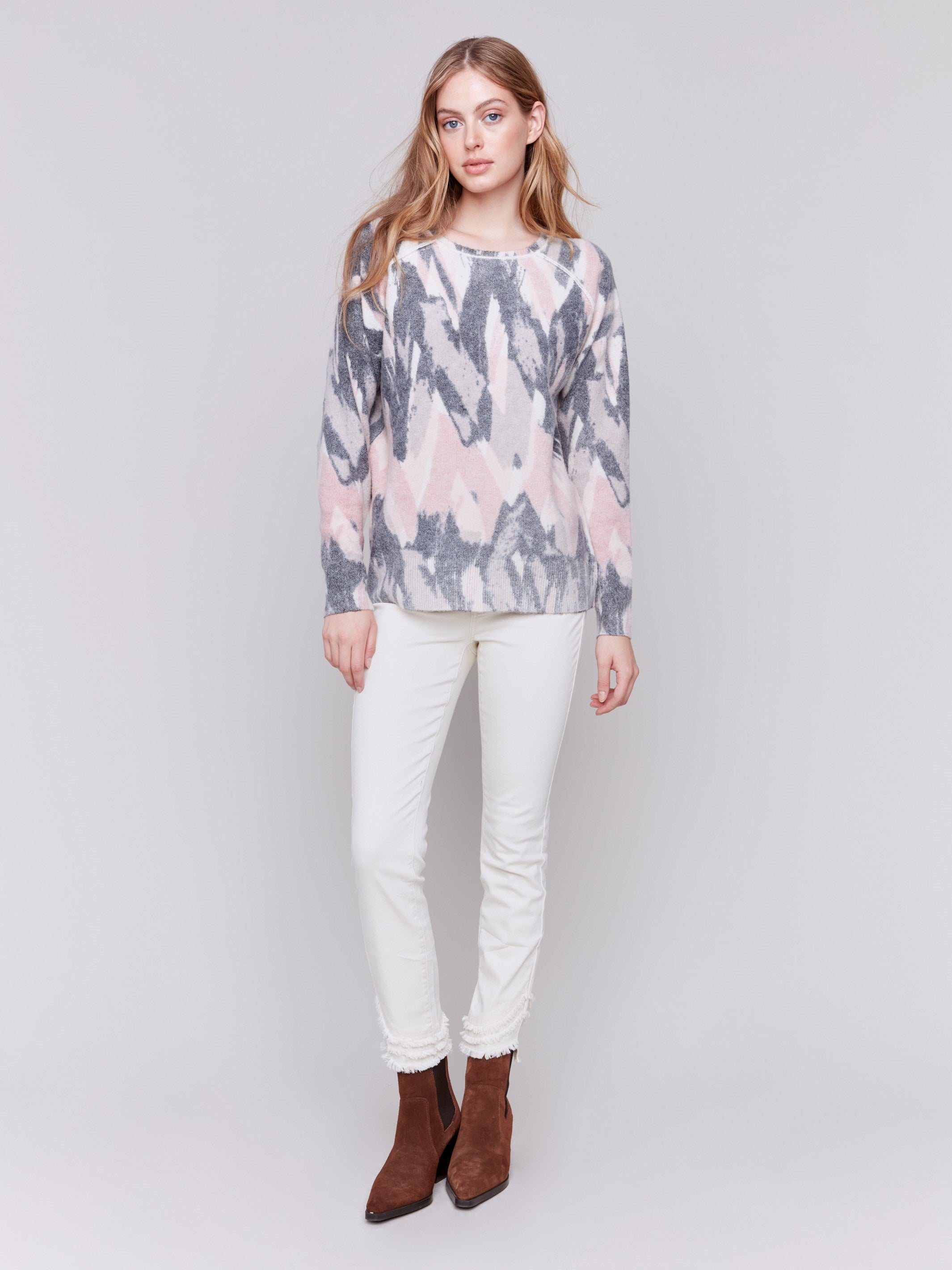 Woodrose reversible sweater with an abstract pattern, featuring raglan sleeves and a crew neckline by Charlie B.