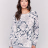 Black and grey reversible sweater with a abstract pattern, featuring raglan sleeves and a crew neckline by Charlie B.