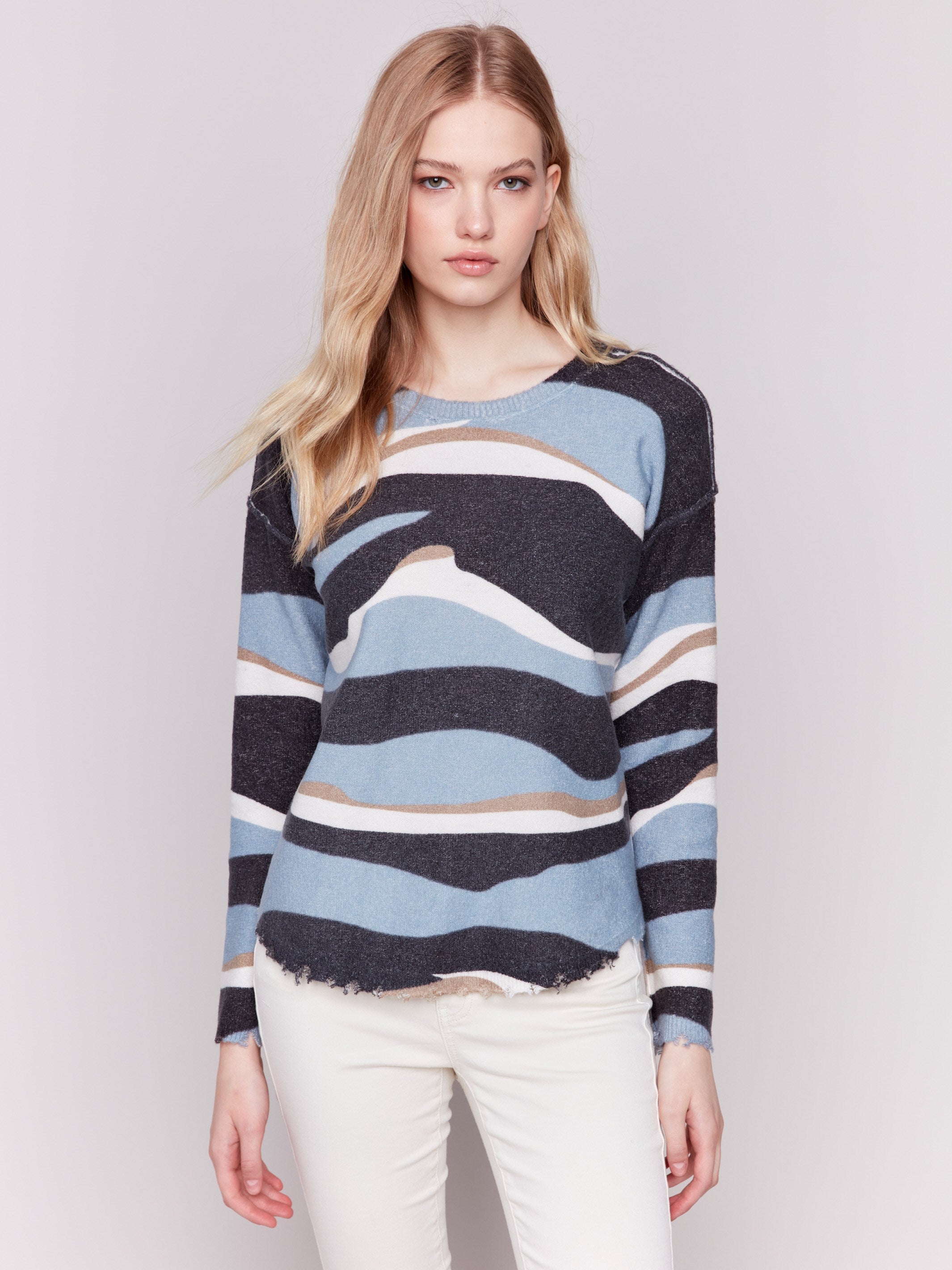 Reversible denim printed plush sweater with frayed edges and boatneck by Charlie B.