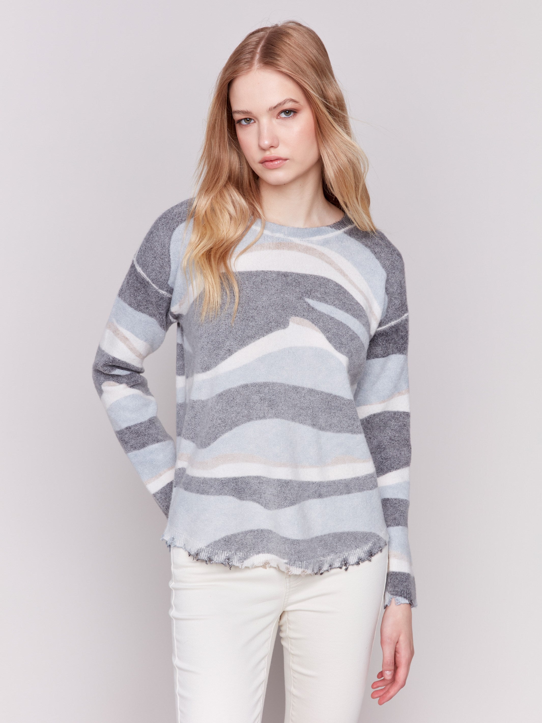 Reversible denim printed plush sweater with frayed edges and boatneck by Charlie B.