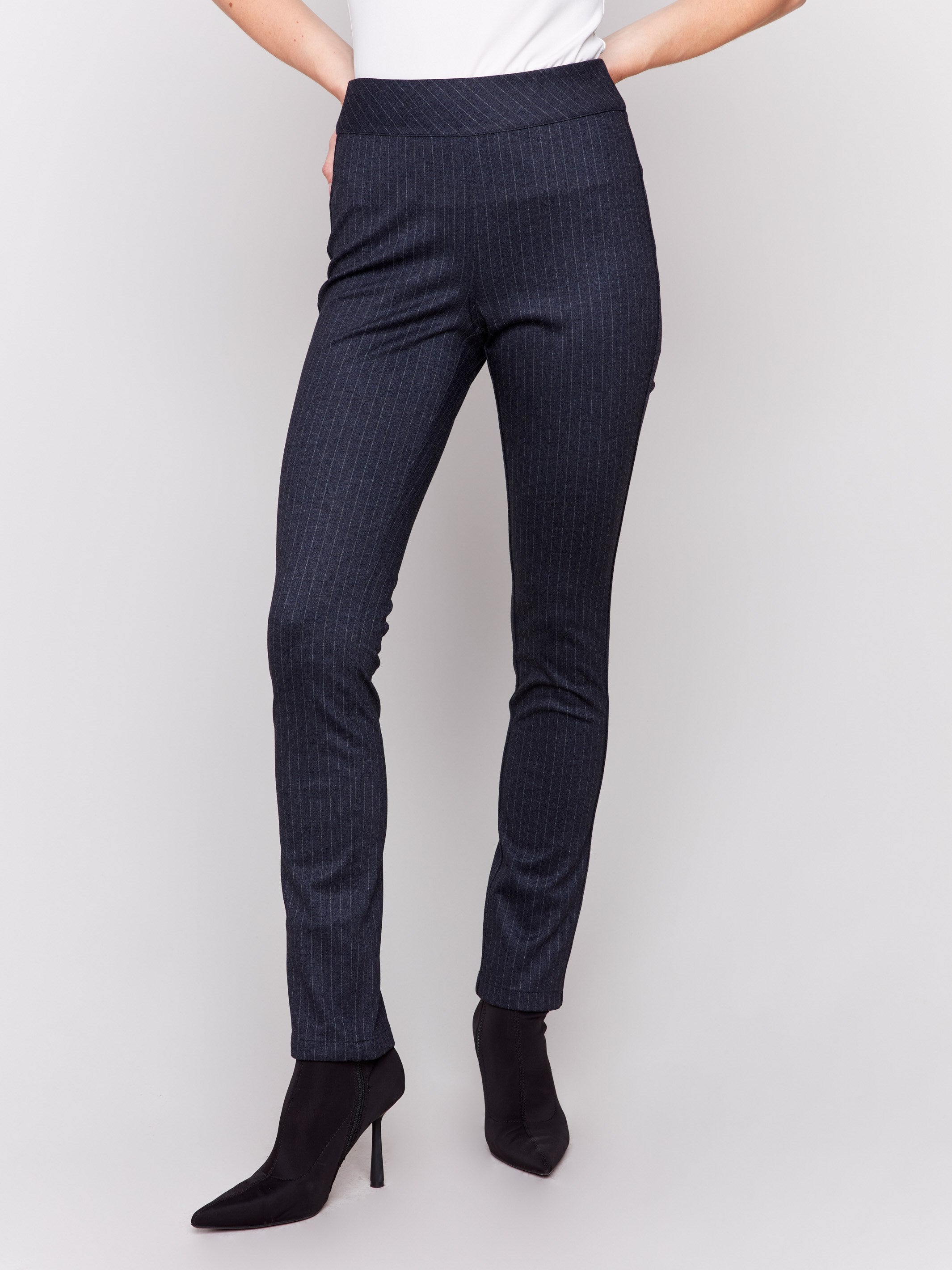 Reversible pull-on pants in blue with a striped pattern on one side and blue pattern on the other, featuring a slim leg and mid-rise fit by Charlie B.