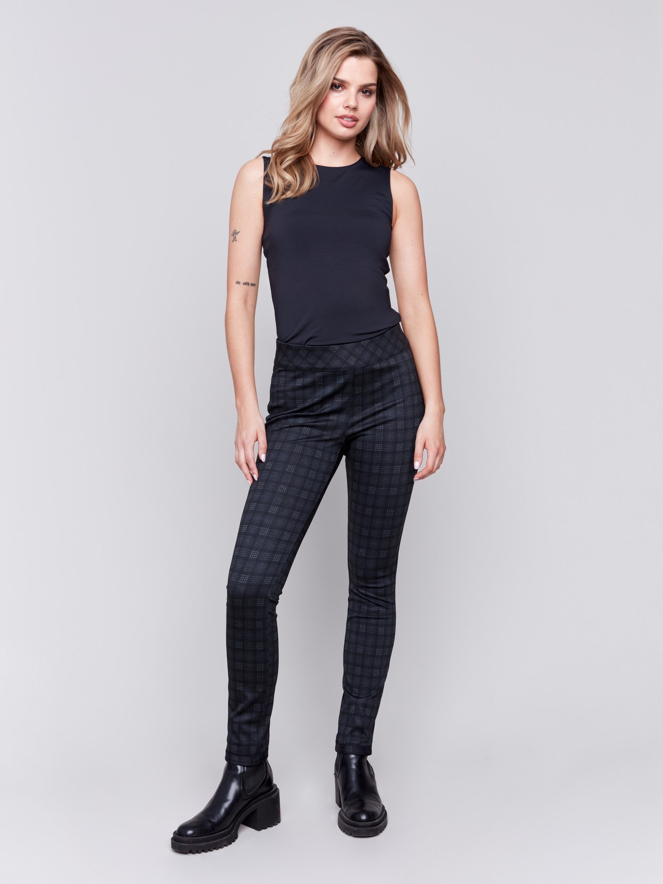 Reversible pull-on pants in grey with plaid pattern on one side and dark pattern on the other, featuring a slim leg and mid-rise fit by Charlie B.