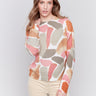 Women wearing reversible printed sweater with artistic prints and a crew neckline by Charlie B.