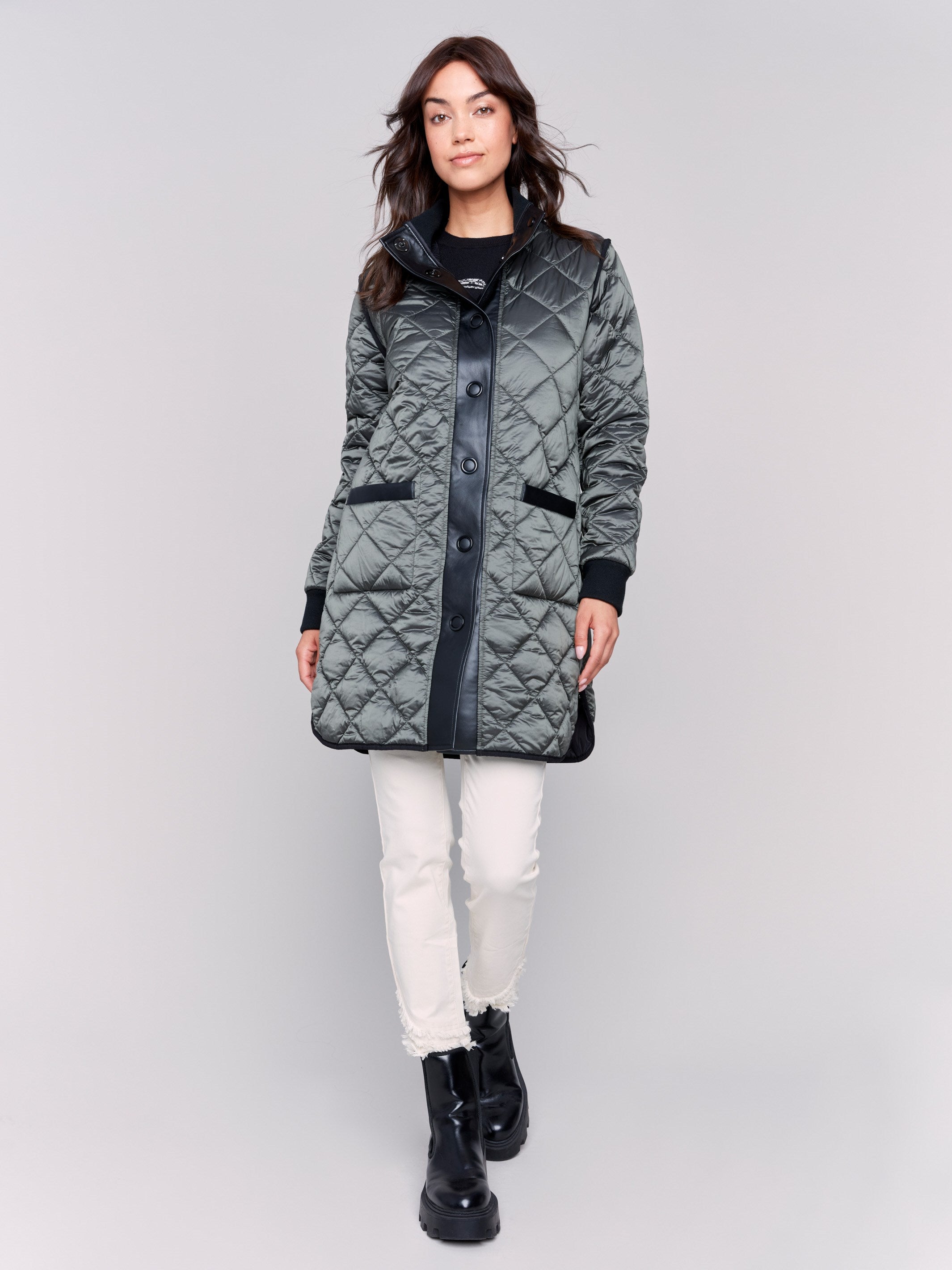 Black and green quilted puffer jacket reversible to white with a high collar and patch pockets by Charlie B.