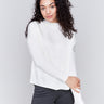 Ecru white satin-knit top with a mock neck and front seam detail, featuring long sleeves and ribbed cuffs by Charlie B.