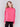 Magenta pink satin-knit top with a mock neck and front seam detail, featuring long sleeves and ribbed cuffs by Charlie B.