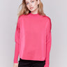 Magenta pink satin-knit top with a mock neck and front seam detail, featuring long sleeves and ribbed cuffs by Charlie B.