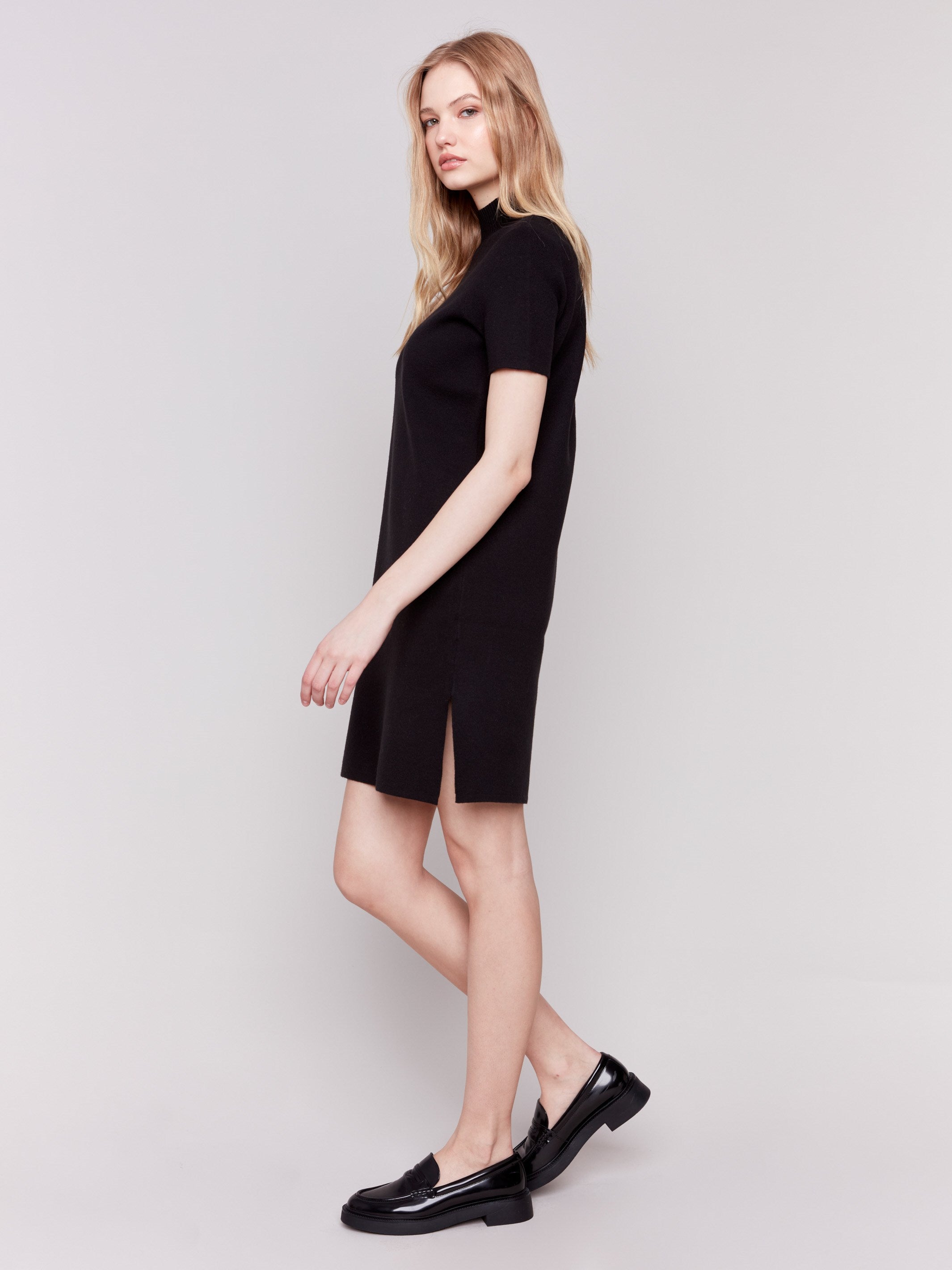 Black short-sleeve mock neck sweater dress with side slits by Charlie B.