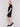 Black short-sleeve mock neck sweater dress with side slits by Charlie B.