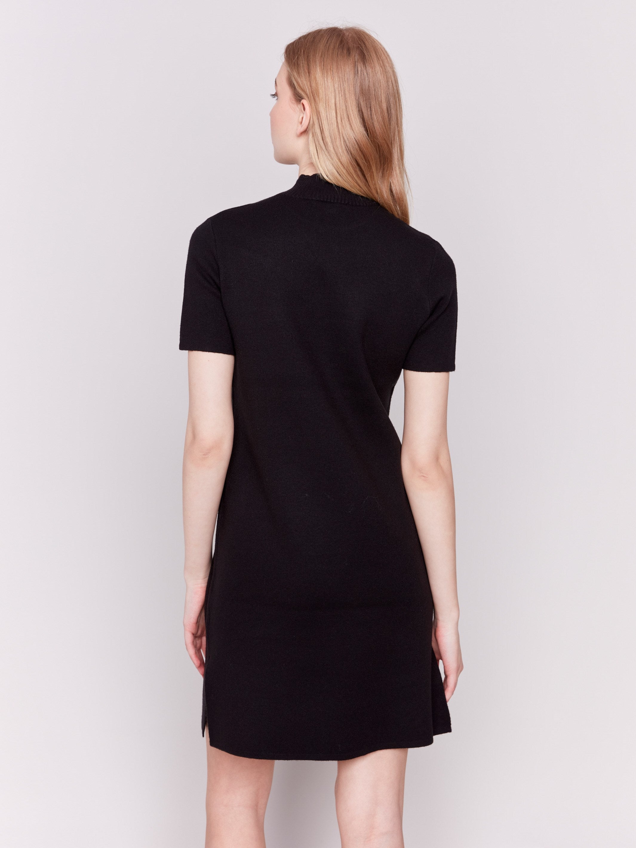 Black short-sleeve mock neck sweater dress with side slits by Charlie B.