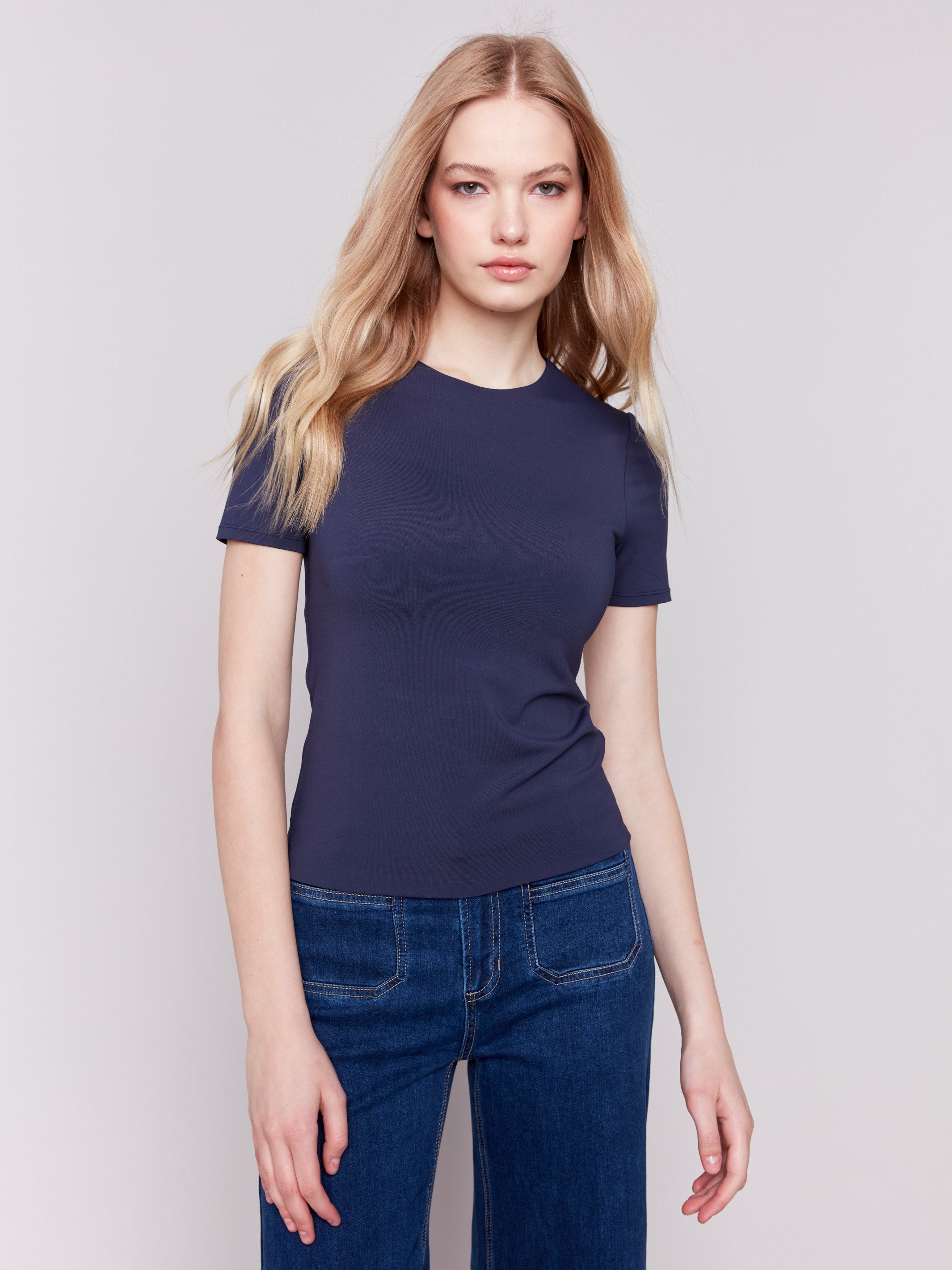 Navy short-sleeved super stretch top with a crew neckline, showcasing a slim fit design by Charlie B.