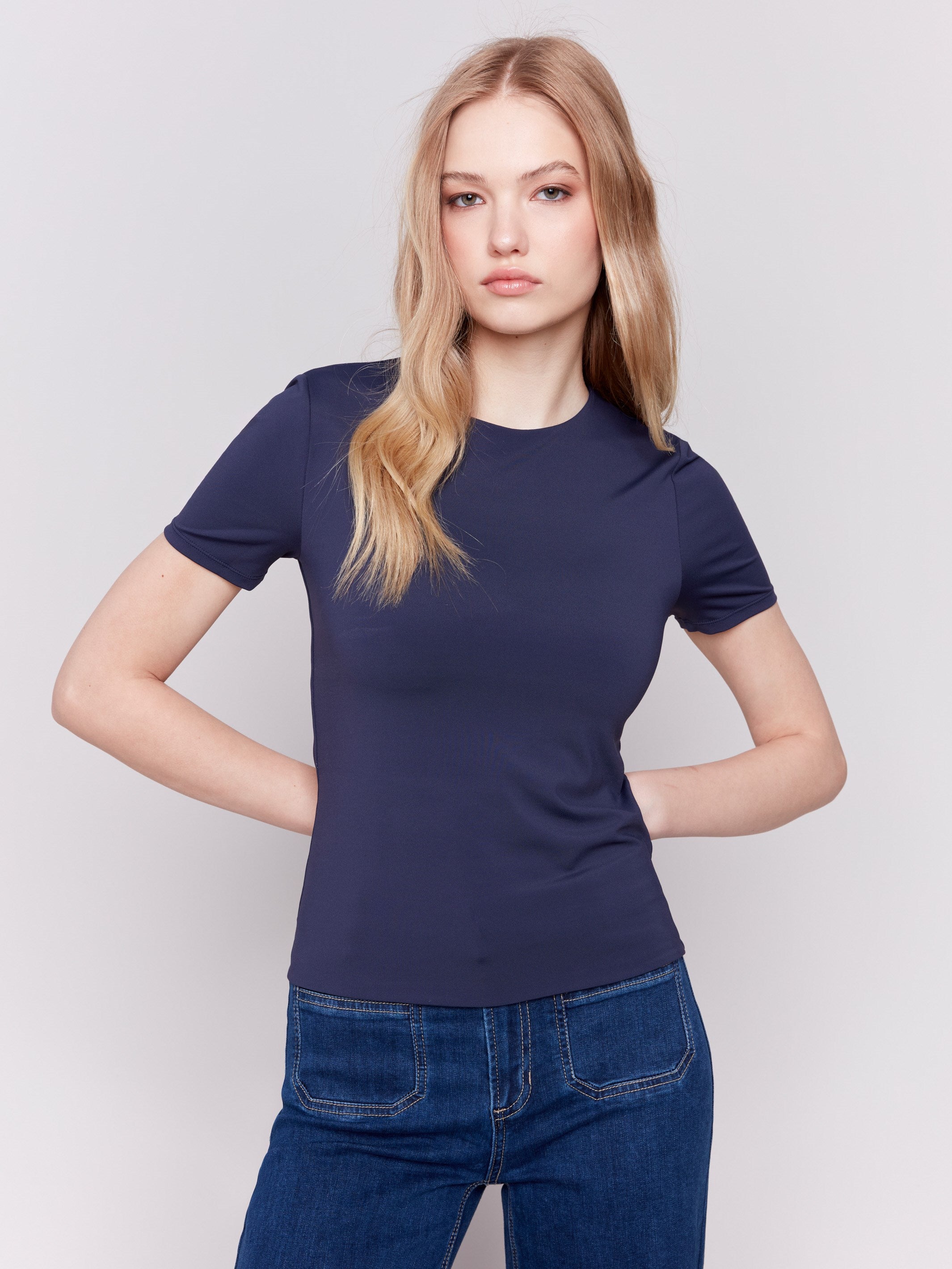 Navy short-sleeved super stretch top with a crew neckline, showcasing a slim fit design by Charlie B.