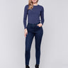 Blue black skinny jeans with a skinny fit, mid-rise, and side zipper pocket details by Charlie B.