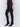 Black skinny twill pants with a mid-rise waist, skinny fit, and front zipper pocket detail by Charlie B.