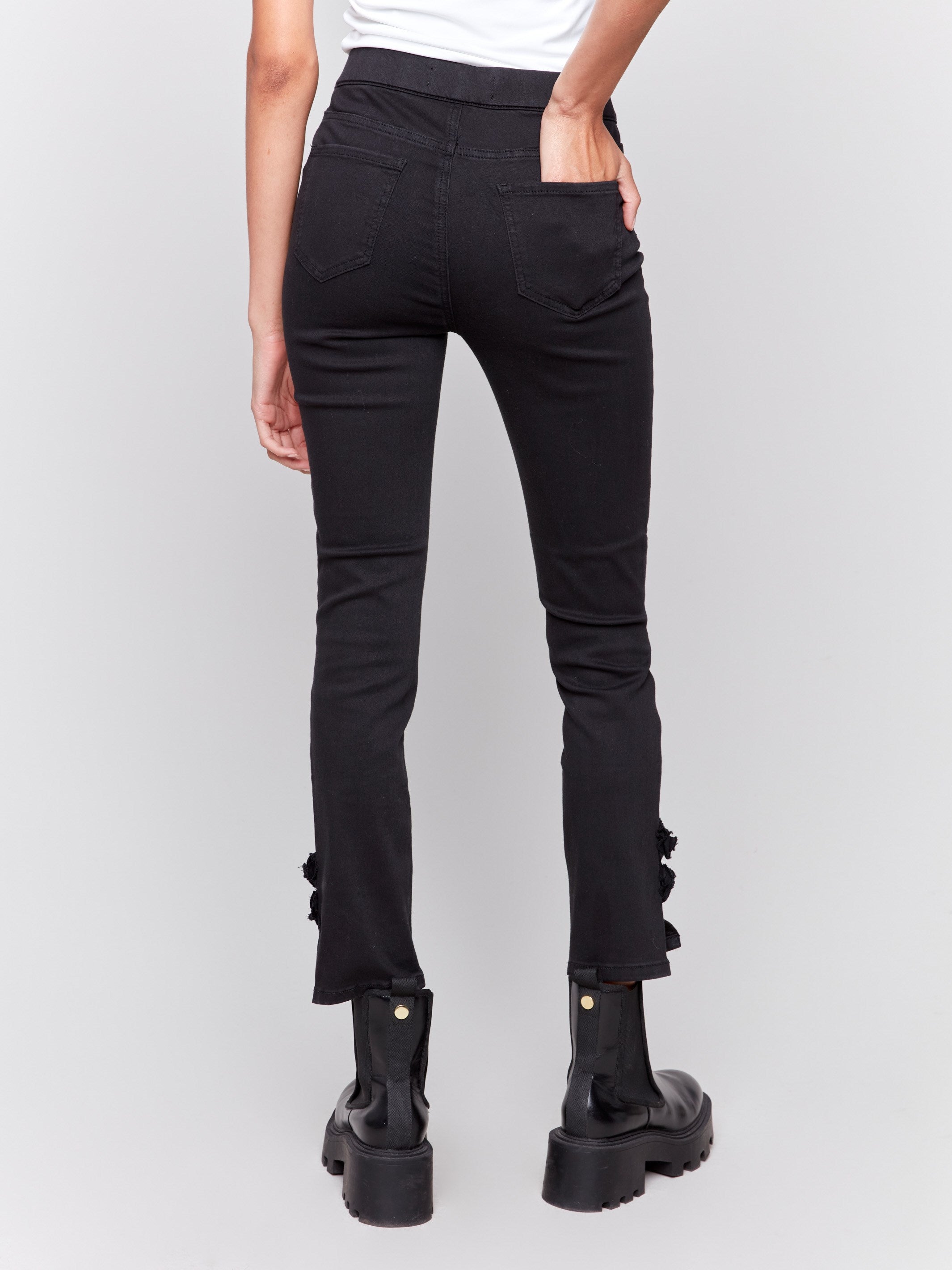 Black slim twill pants with side rose embroidery by Charlie B, featuring a regular rise and slim-leg design.