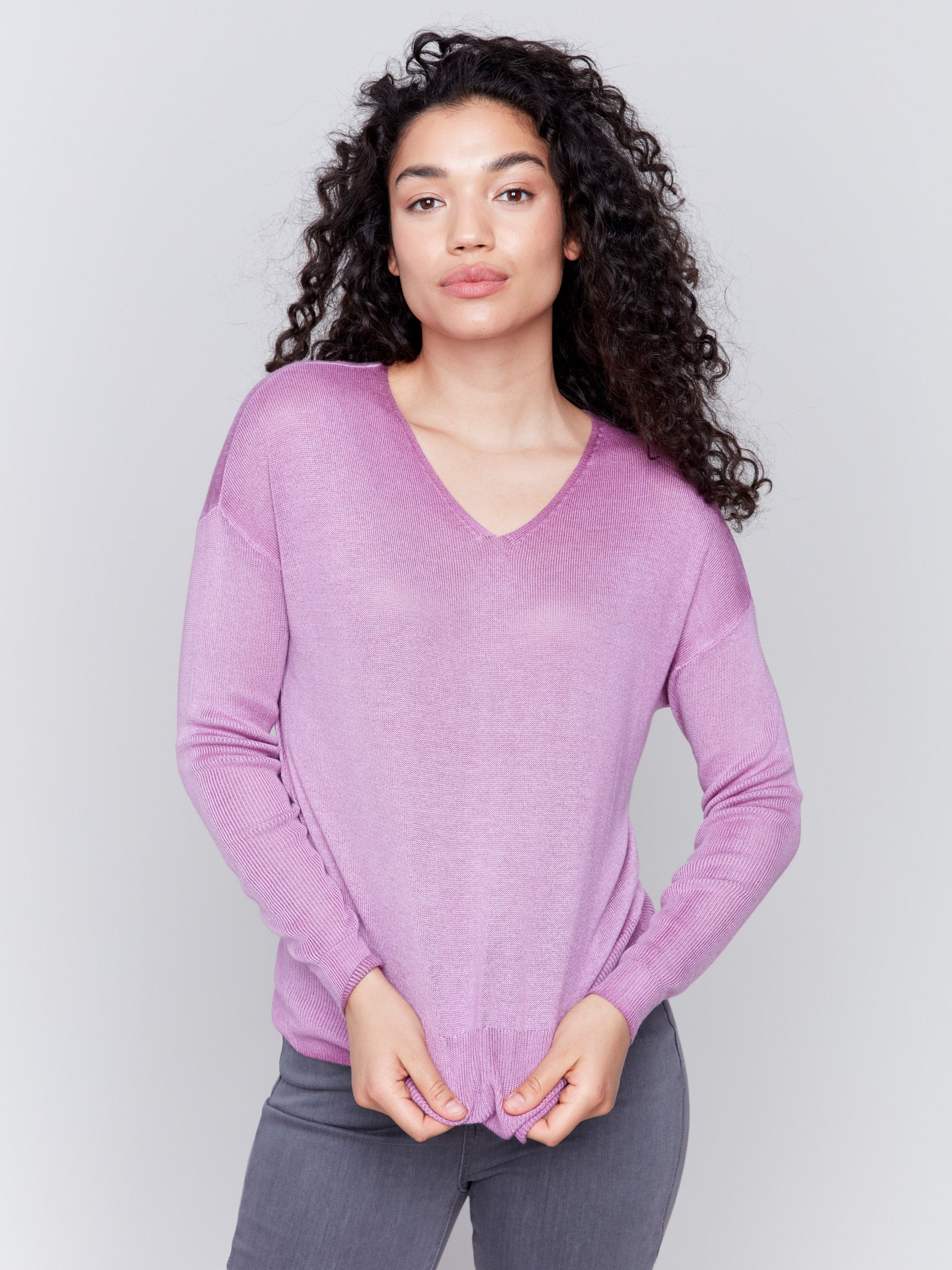 Mulberry purple V-neck sweater with long sleeves, showcasing a relaxed fit and snow wash texture by Charlie B.