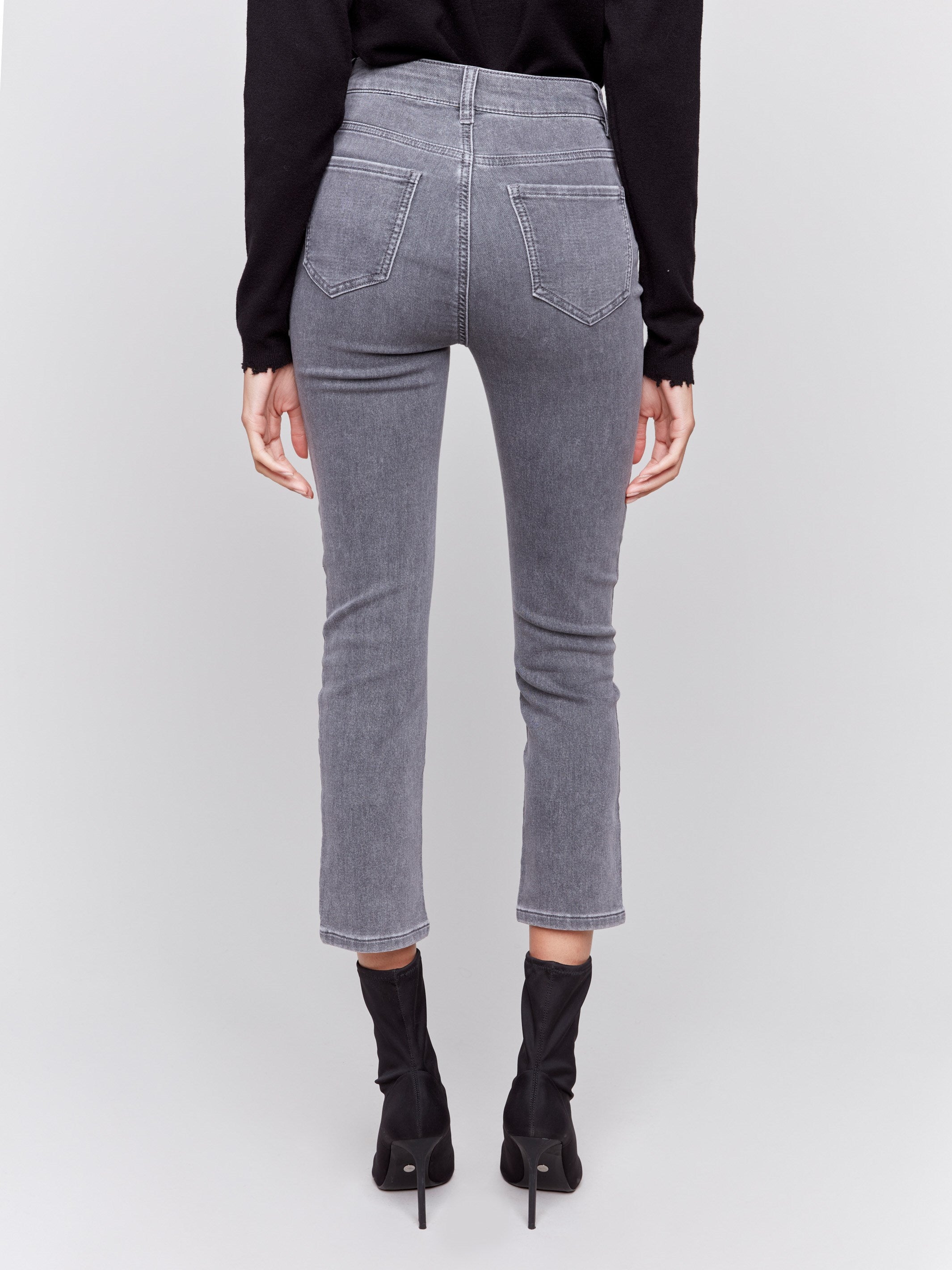 Medium grey slim-leg denim pants with all-over studs by Charlie B.