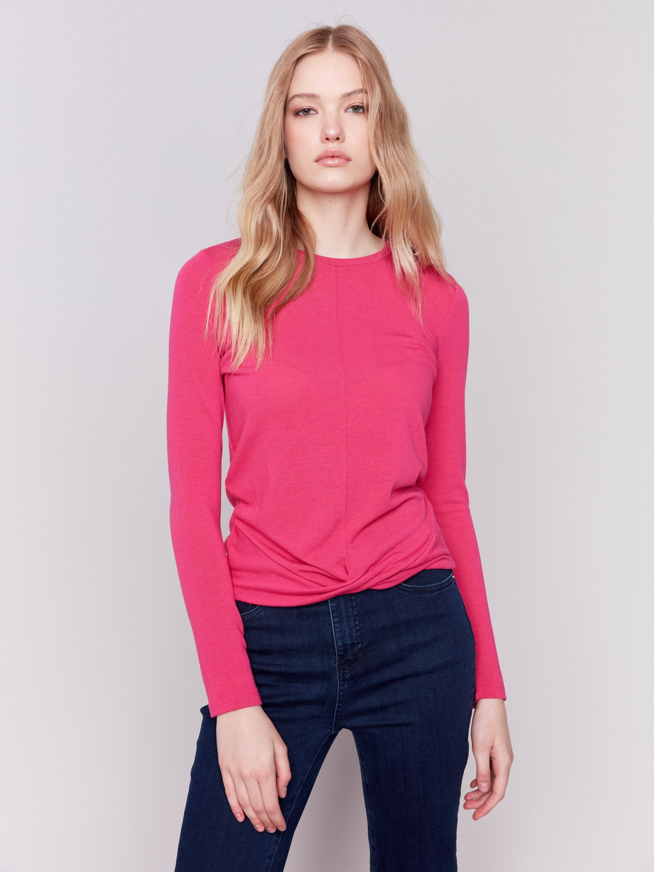 Magenta pink long-sleeve jersey top featuring a crew neckline and a unique front knot detail by Charlie B.