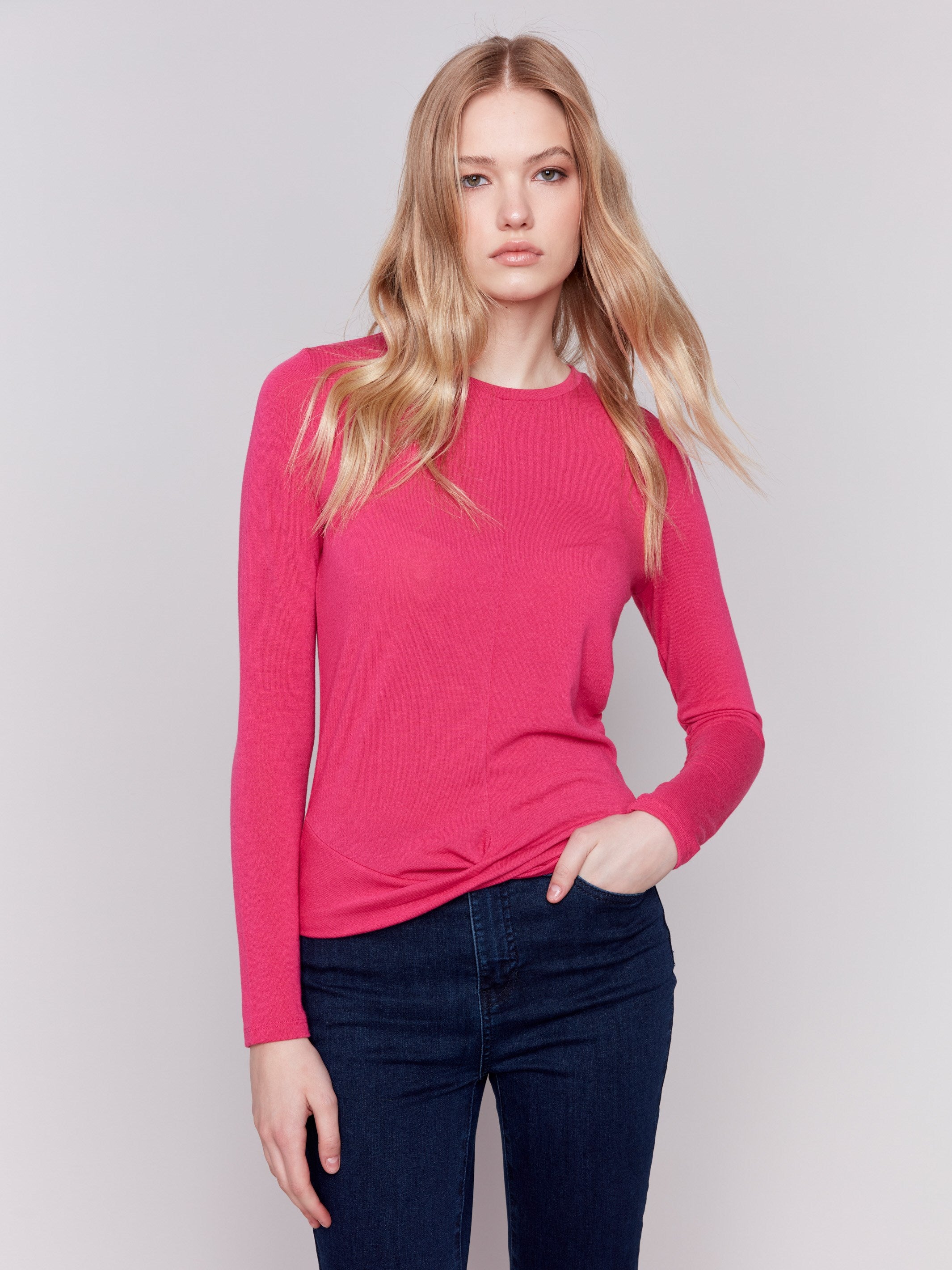 Magenta pink long-sleeve jersey top featuring a crew neckline and a unique front knot detail by Charlie B.