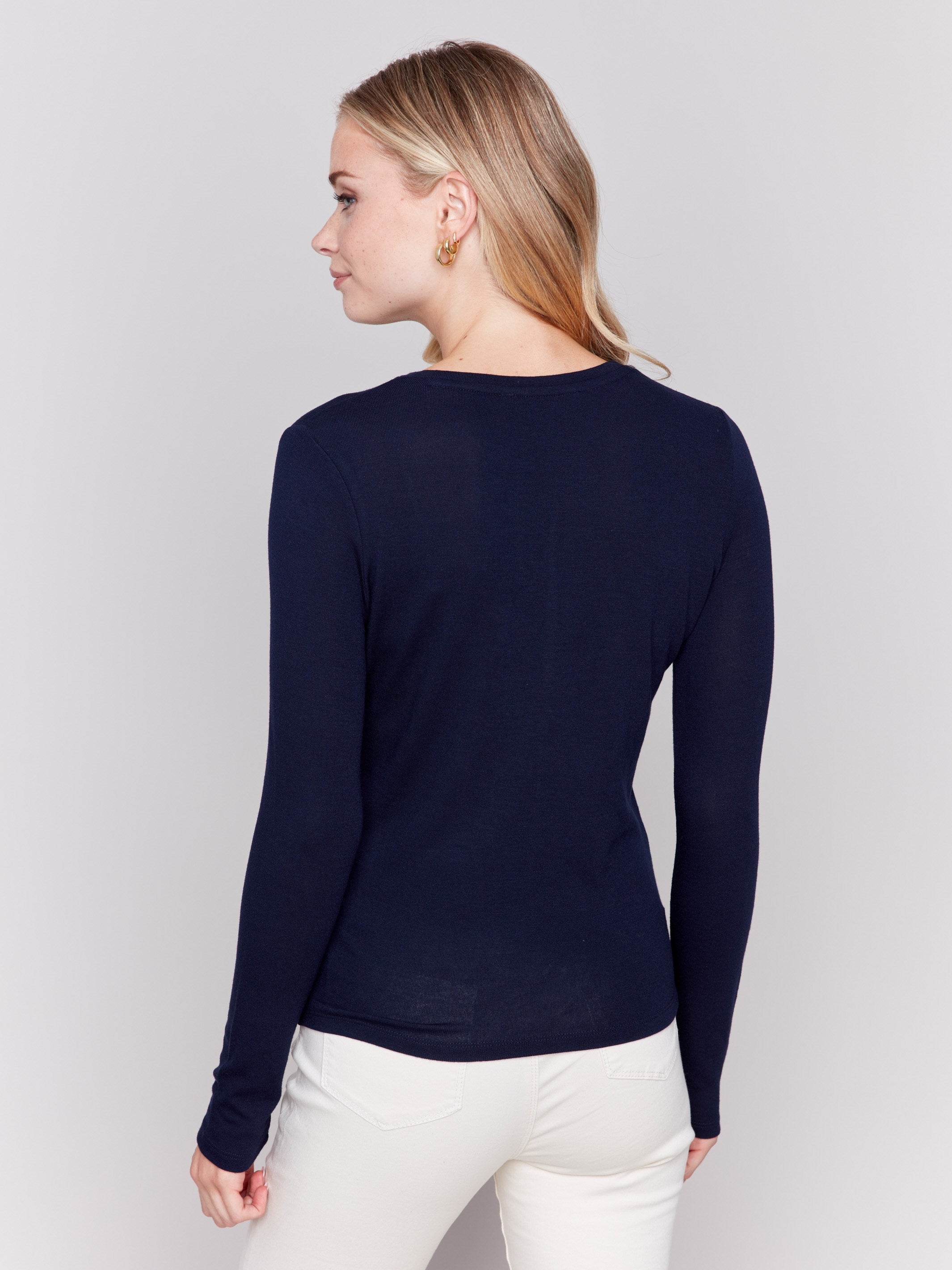 Navy blue long-sleeve jersey top featuring a crew neckline and a unique front knot detail by Charlie B.