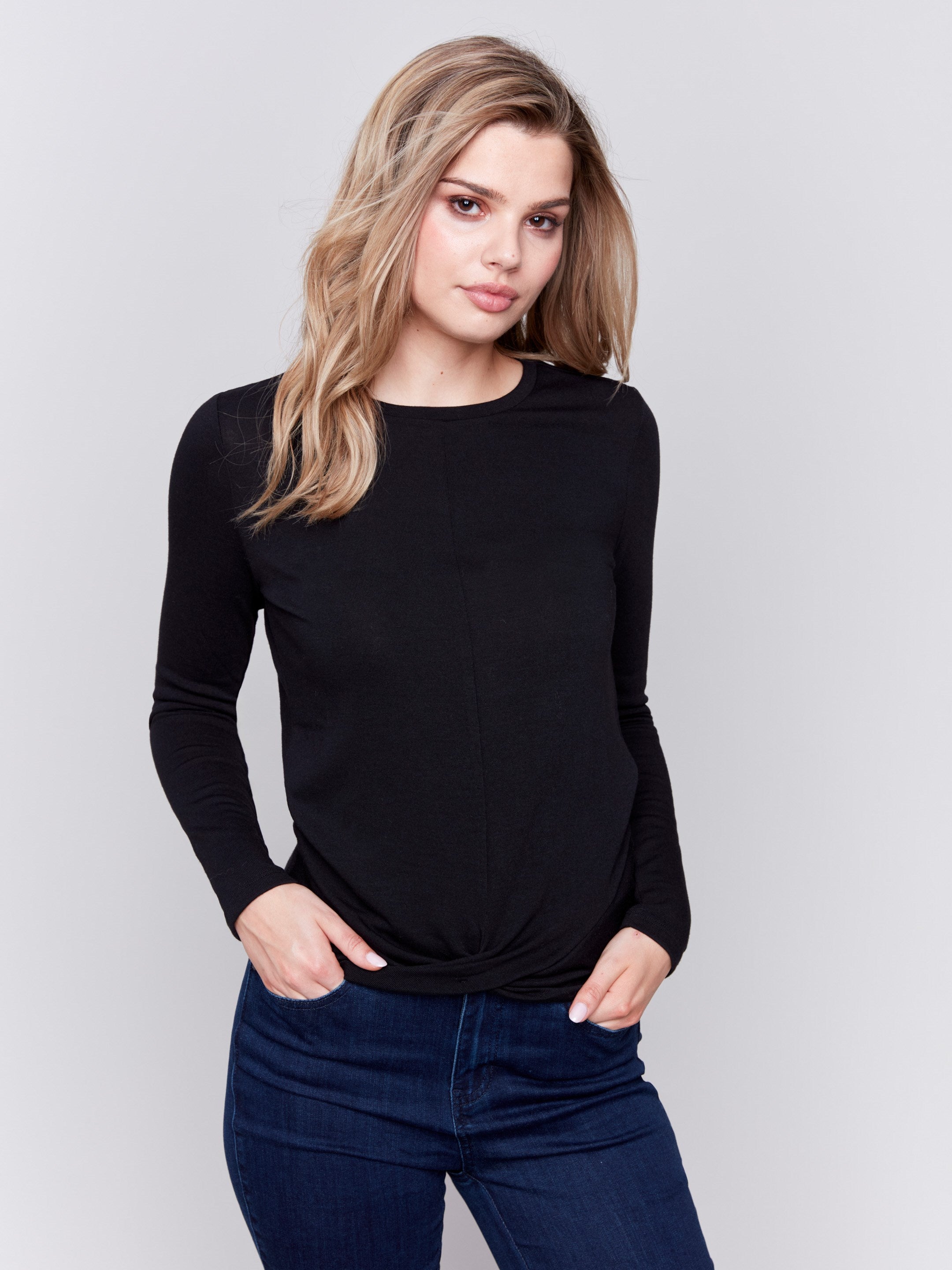 Black long-sleeve jersey top featuring a crew neckline and a unique front knot detail by Charlie B.