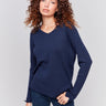 Navy blue V-neck sweater with long sleeves featuring side slits, made from plushy yarn by Charlie B.